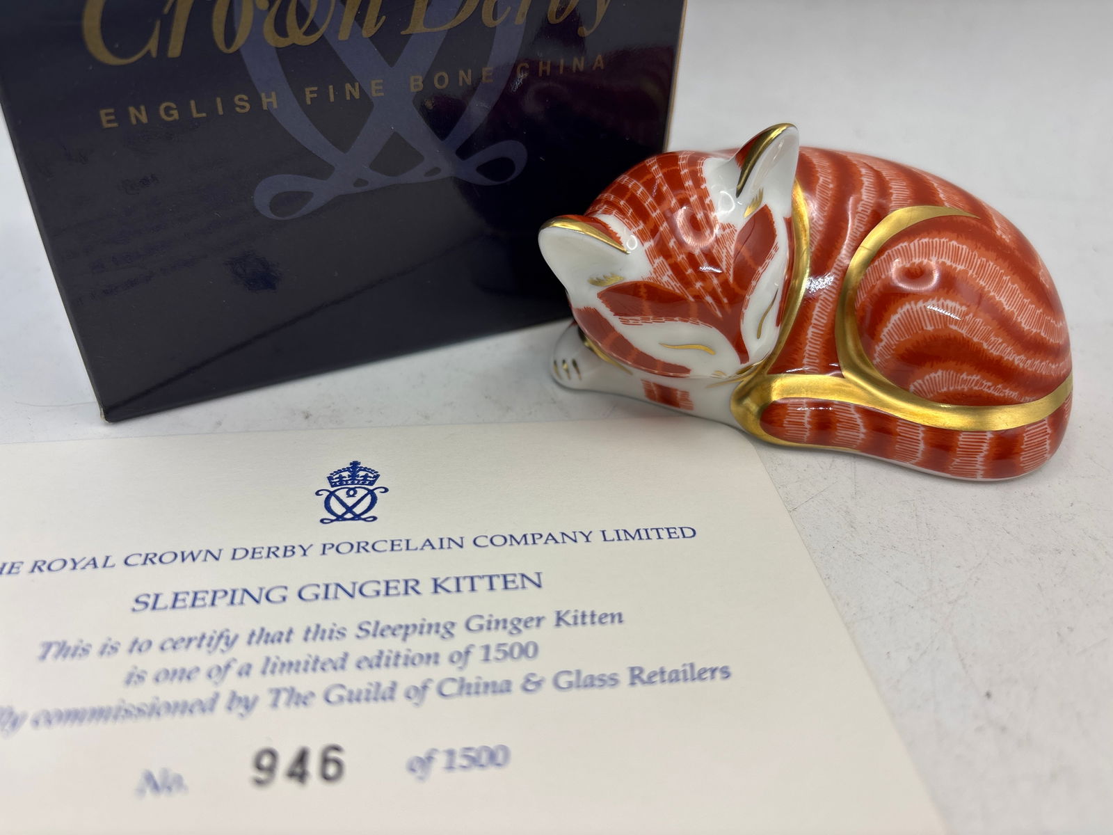 Specially Commissioned limited Ed. sleeping Ginger Kitten Royal Crown Derby 3&1/2 inch paperweight: With COA. box and gold stopper. Royal Crown Derby sleeping Ginger Kitten bone china paperweight.