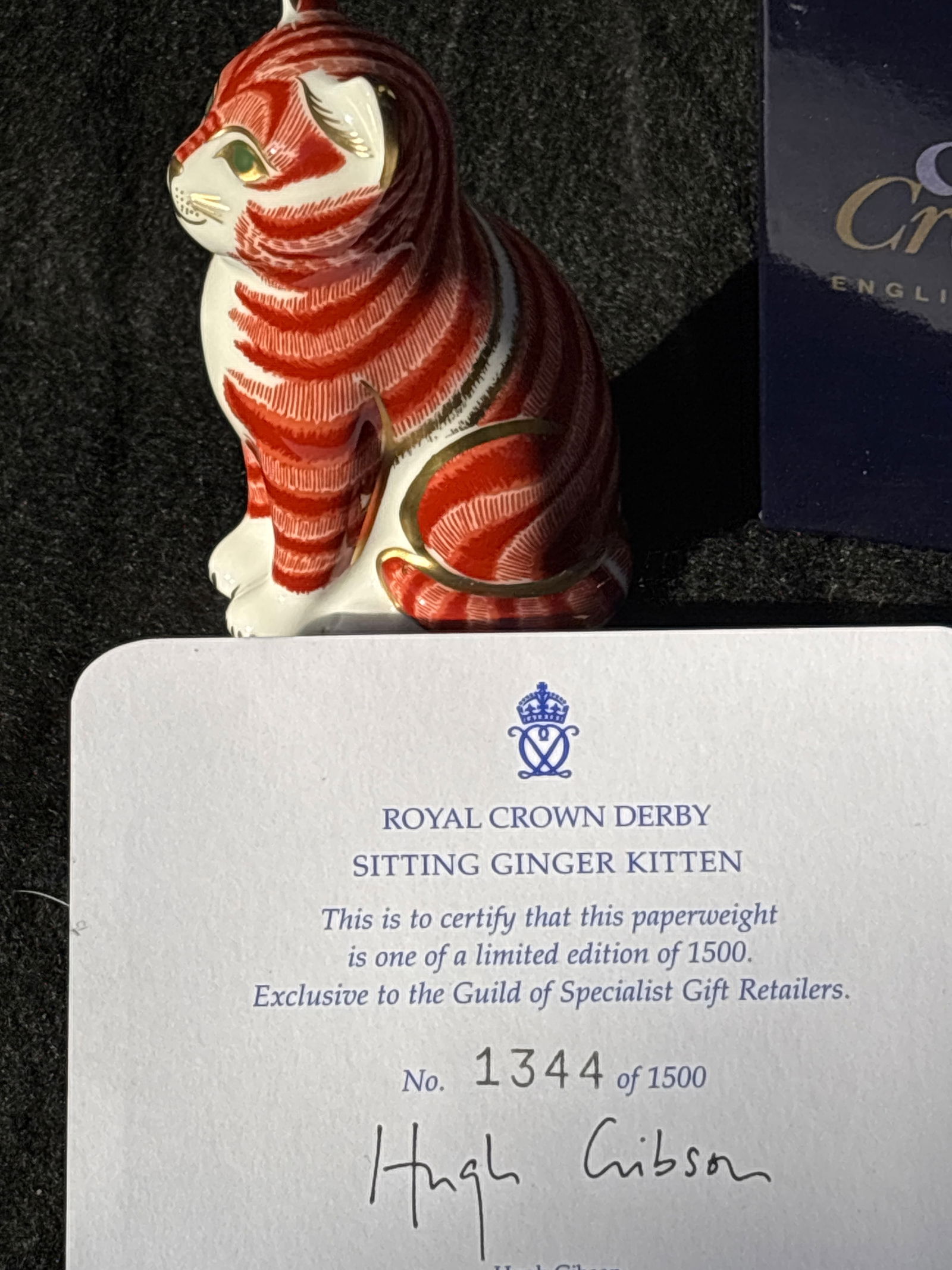 Limited edition Royal Crown Derby ‘Sitting Ginger Kitten’ 3 inch paperweight: Gold stopper. With box.Royal Crown Derby "Sitting Ginger Kitten” paperweight, known for its distinctive orange/red and white Imari pattern. Stands approximately 5 inches tall.Features a vibrant