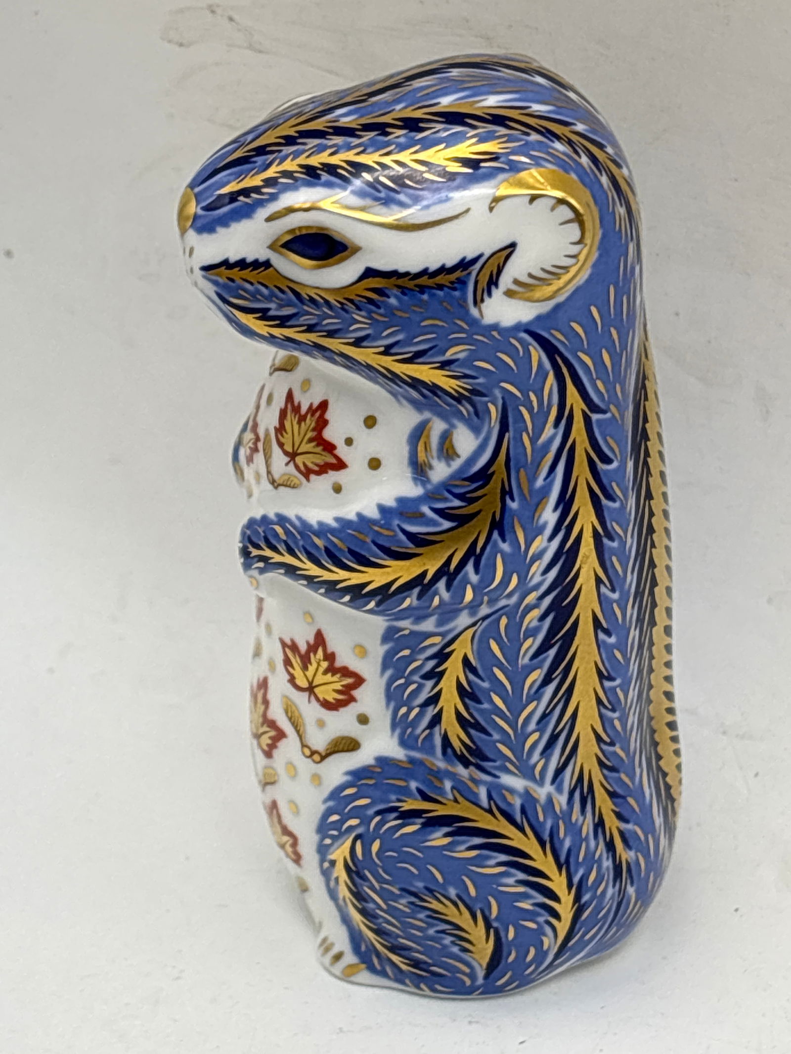 Imari blue chipmunk Royal Crown Derby 3&1/2 inch paperweight: Imari blue chipmunk Royal Crown Derby 3&1/2 inch paperweight. Gold stopper. No box.