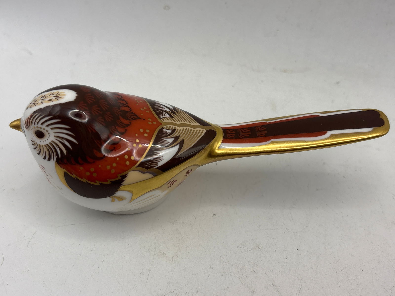 2005 ‘Long Tailed Tit’ Royal Crown Derby 5 inch paperweight: No box. Silver stopper.Royal Crown Derby 'Long Tailed Tit' bird paperweight. It is made from fine bone china and finished with 22-carat or 24-carat gold detailing. The design features the brand's sign