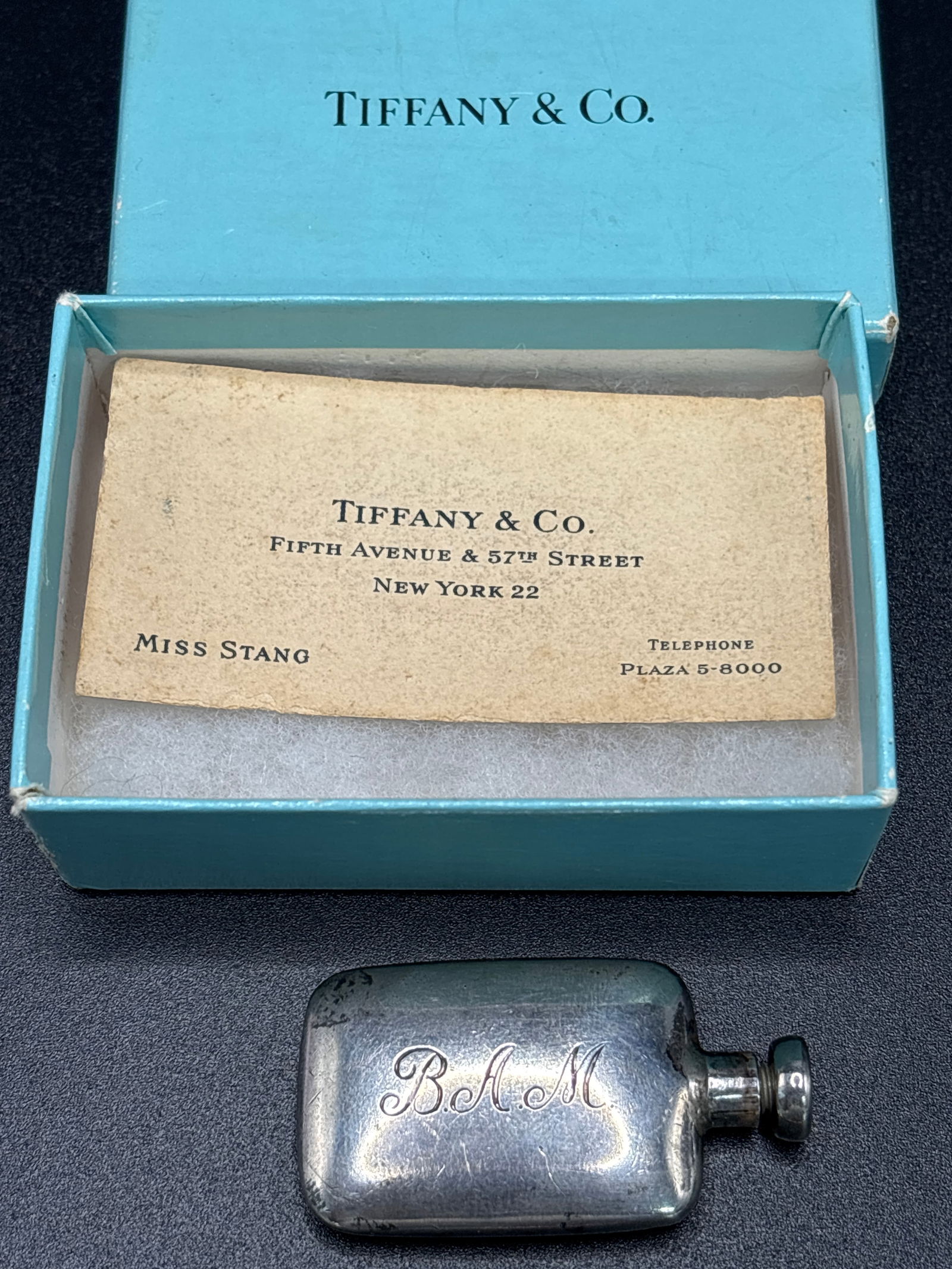 Vintage Tiffany & Co. sterling silver 1&3/4inch perfume flask form bottle w/box; 16.4 grams: Vintage Tiffany & Co. sterling silver 1 &3/4inch perfume flask form bottle16.4 grams.Appears to be original Tiffany robins egg blue box.good condition but lightly tarnished from age.