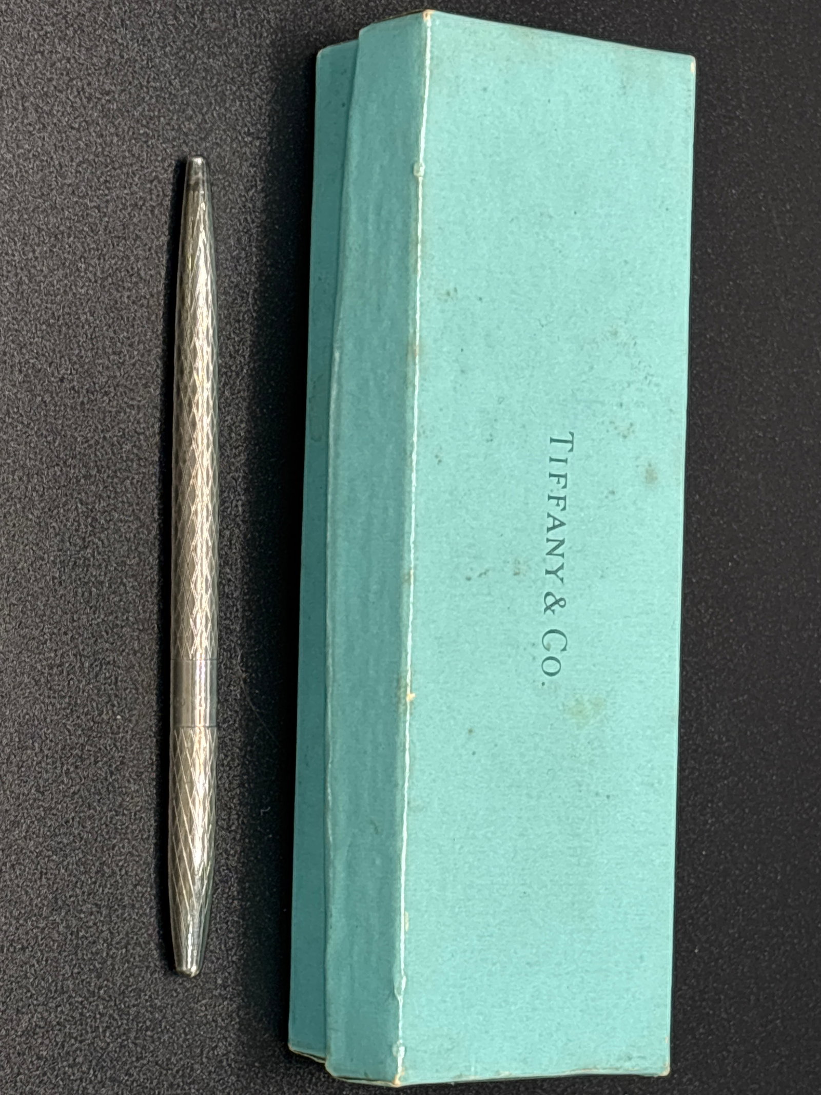 vintage Tiffany & Co. sterling silver 4&1/2 inch writing pen with box; 12.3 grams: vintage Tiffany & Co. sterling silver 4&1/2 inch writing pen with box; 12.3 grams total pen weight. Box is lightly worn.