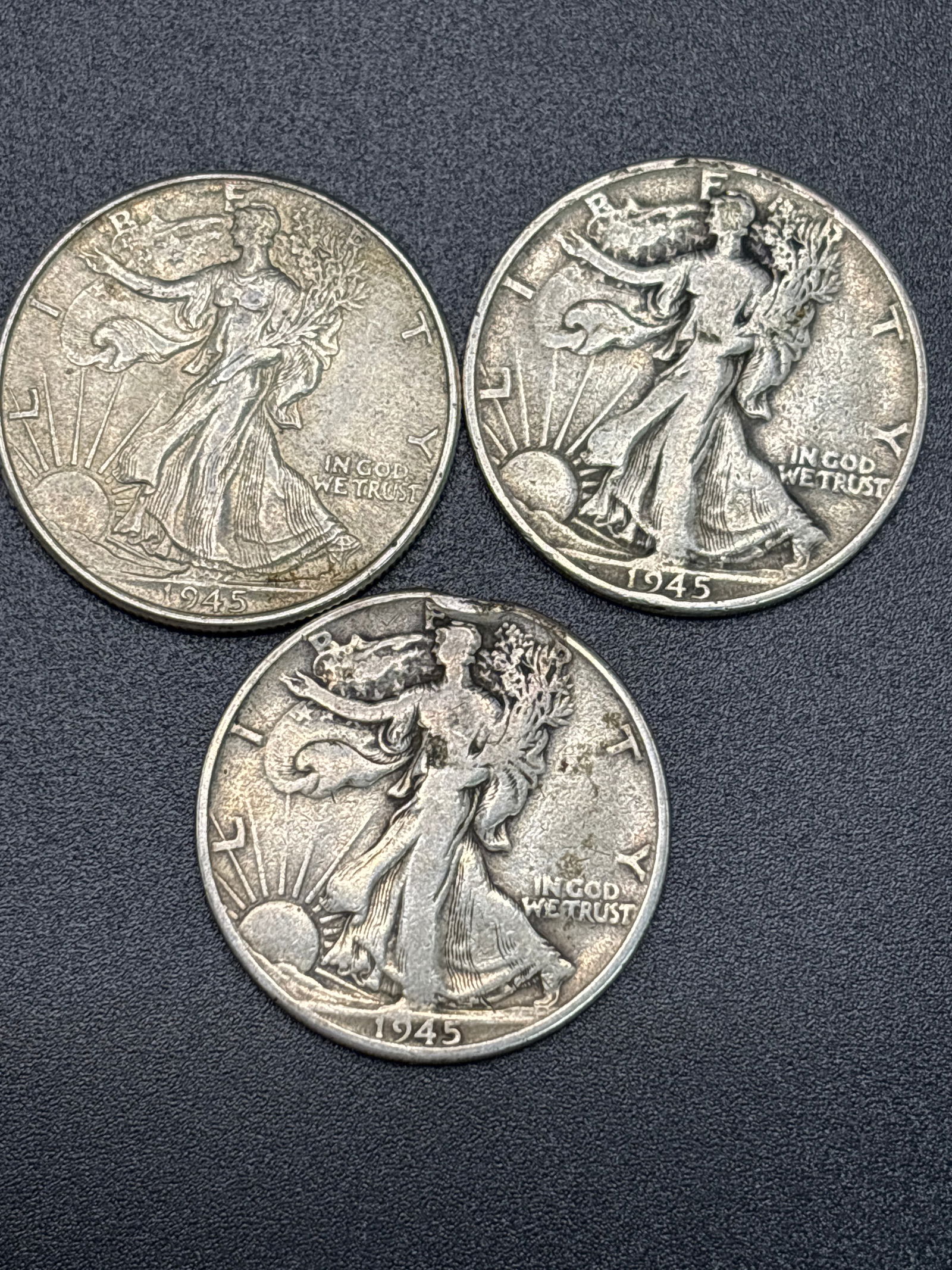 Three WWII era 1945 Walking Liberty silver half dollars; 37grams total (1 of 5)