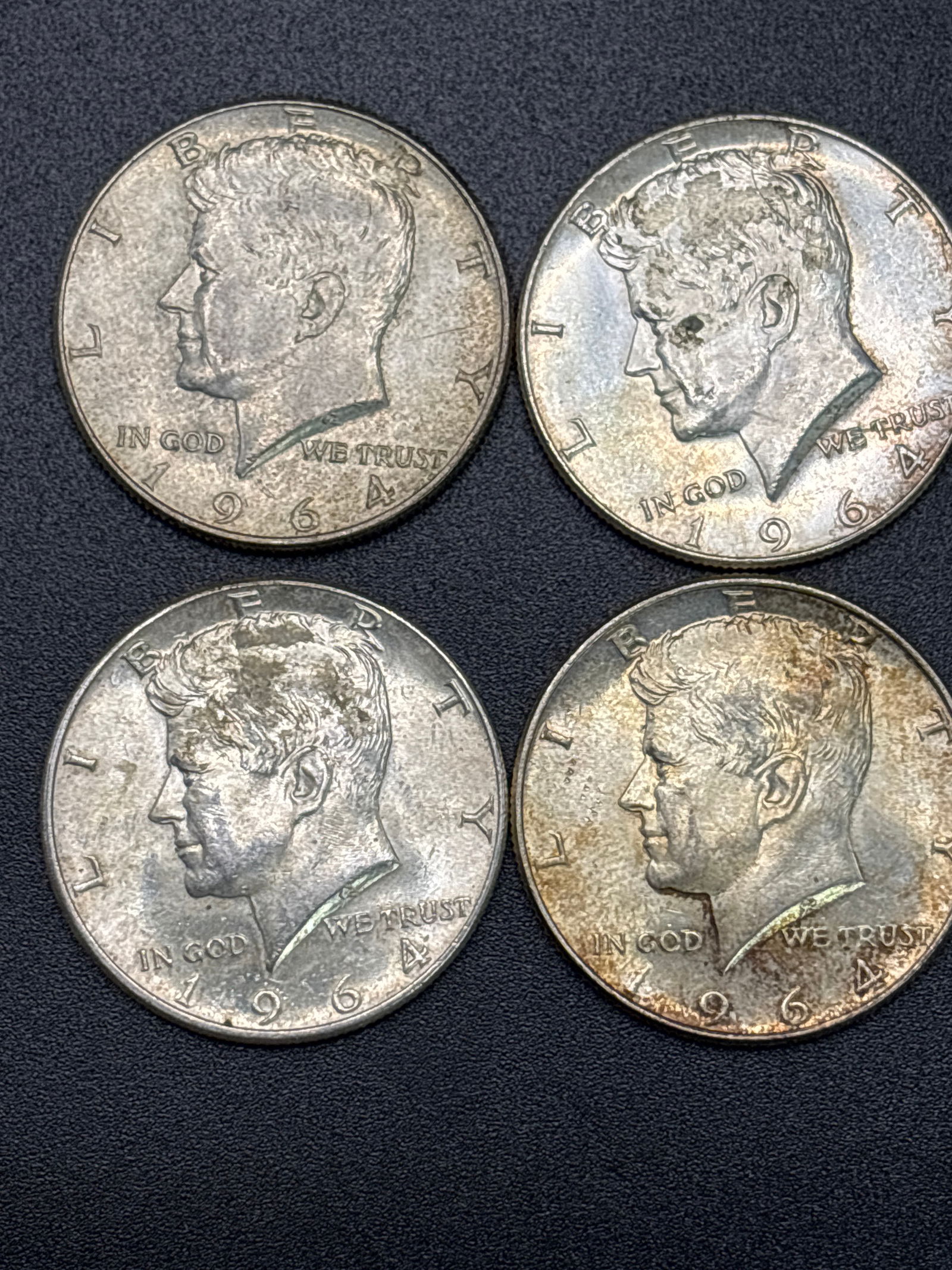 Four 1964 Kennedy silver half dollars; 50 grams total (1 of 4)