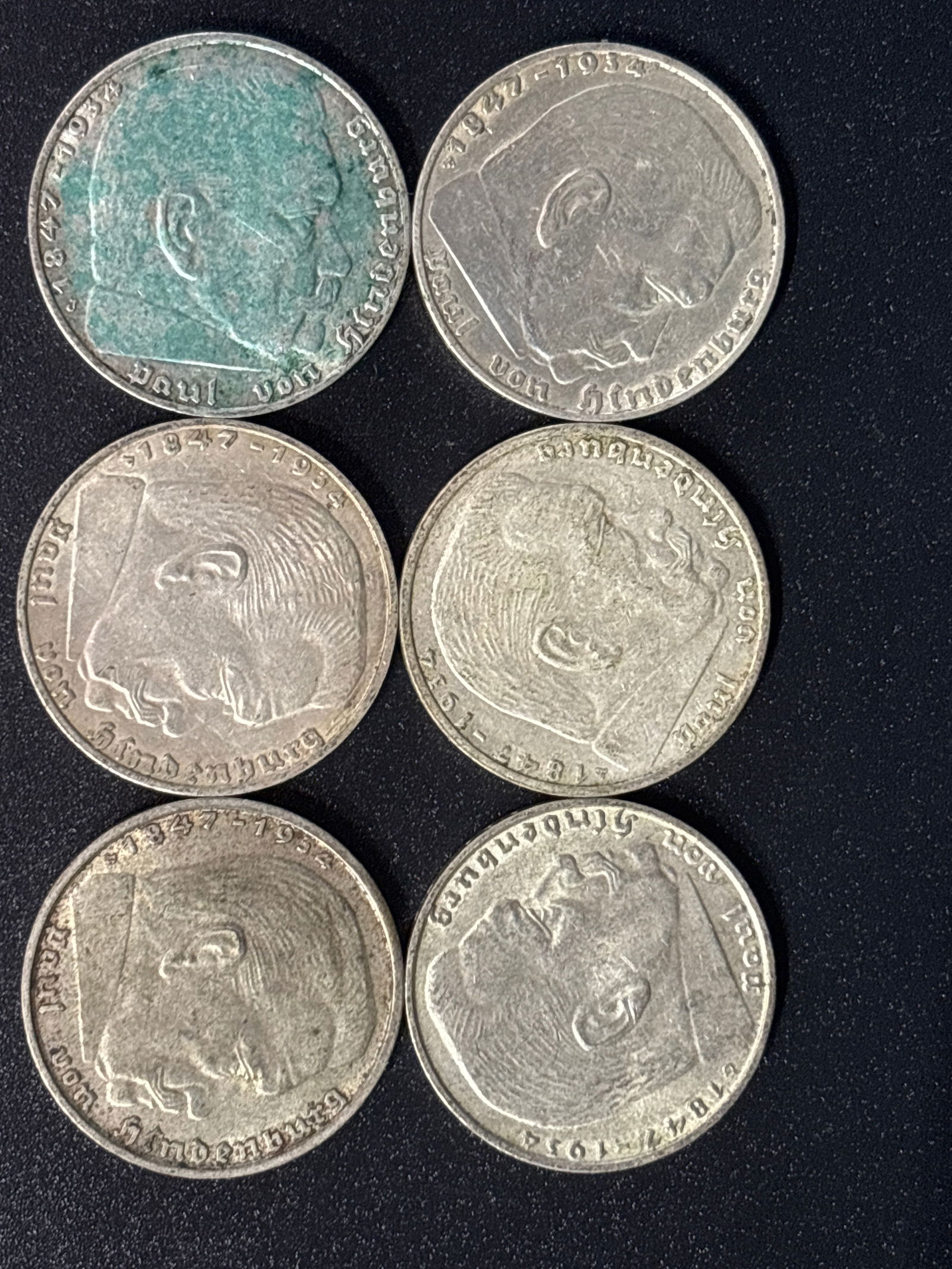 Six 1939 German 2 Reichsmark coin from 1938 Third Reich period: Six German 2 Reichsmark coin from 1938, issued during the Third Reich period. Material: The coin is composed of silver, typically 62.5%. Design: The obverse features the German national eagle holding