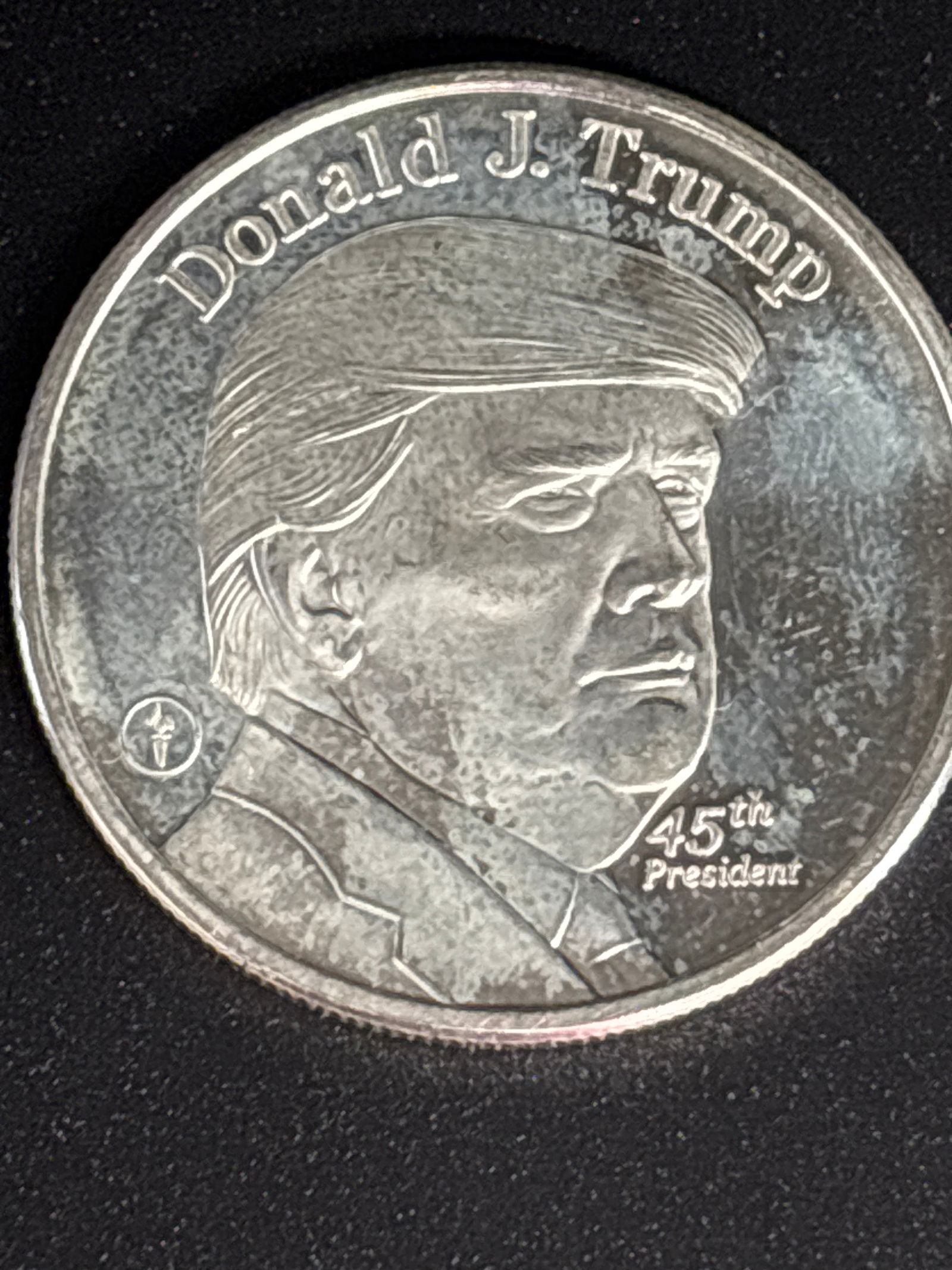 1 troy ounce of .999 fine silver Trump coin: privately minted collectible medal honoring Donald J. Trump as the 45th President of the United States. It is generally made of 1 troy ounce of .999 fine silver.
