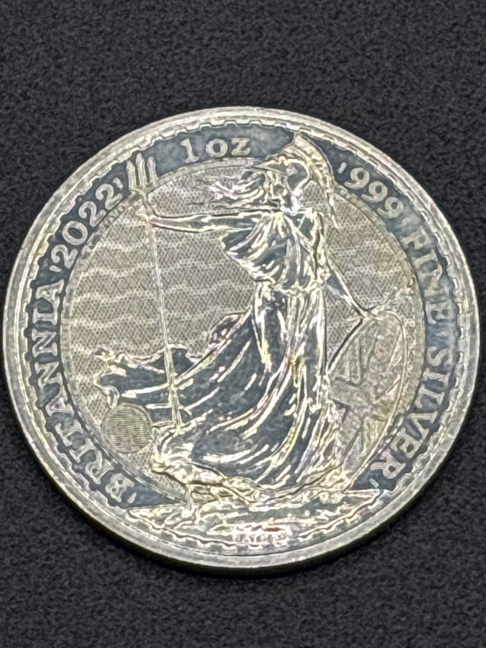 1 troy ounce of .999 fine silver 2022 British Silver Britannia bullion coin: 2022 1 oz British Silver Britannia bullion coin produced by The Royal Mint. It contains 1 troy ounce of .999 fine silver. The reverse features Philip Nathan's iconic design of Britannia wielding a tri