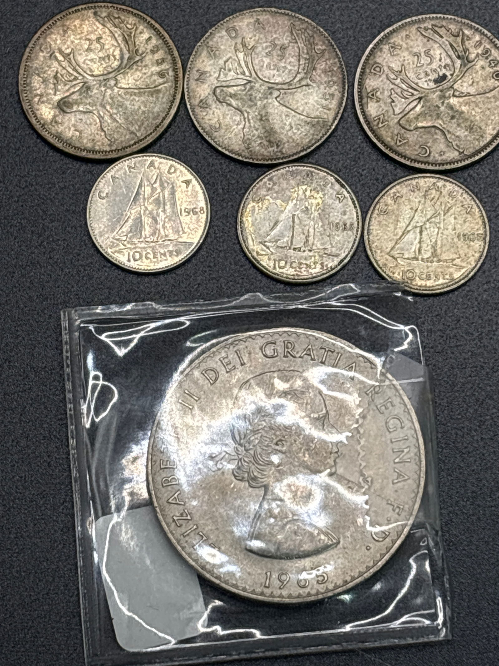 Group lot of seven Canadian silver coins & British commemorative non-silver coin (1 of 6)