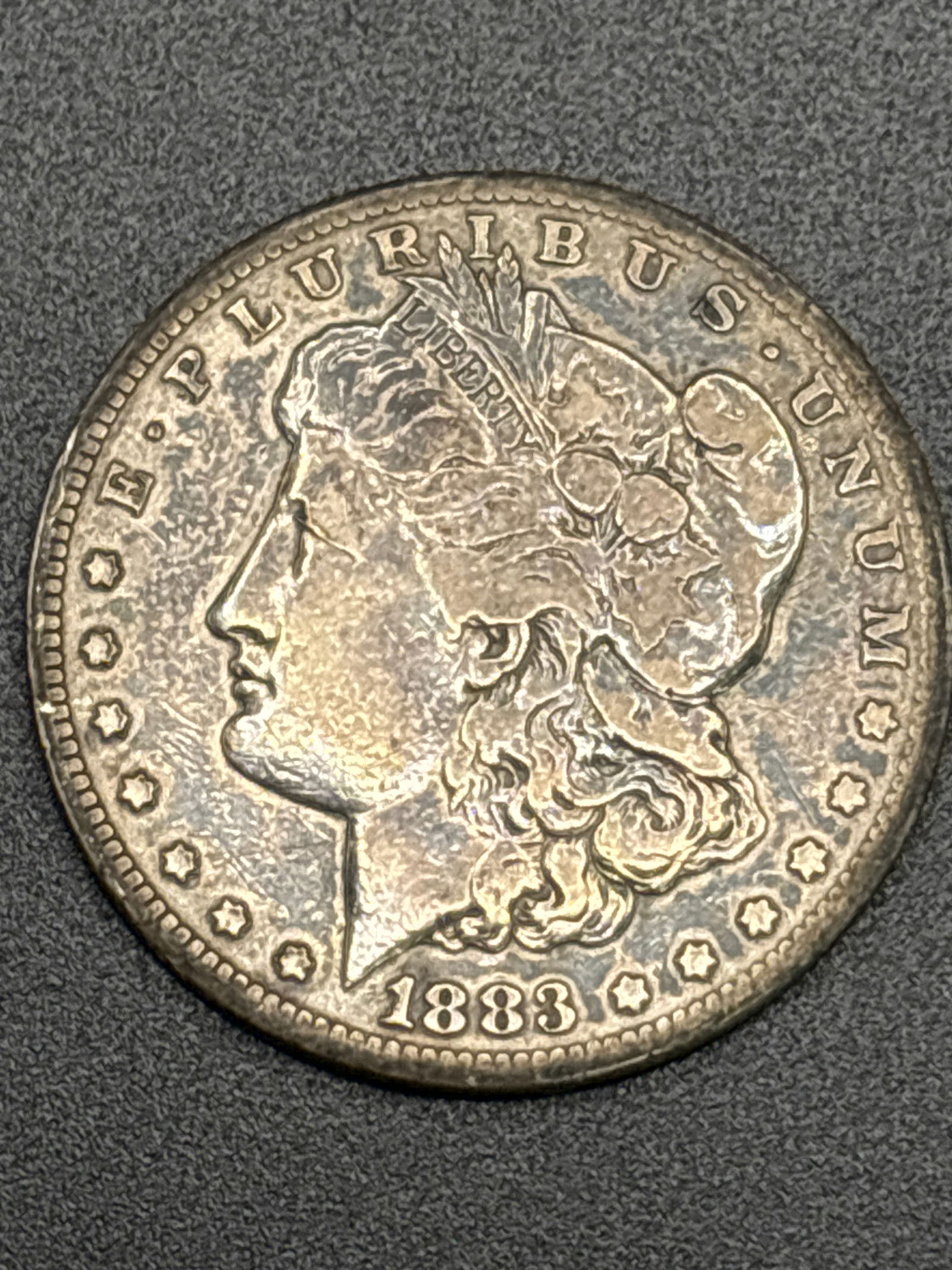 Early 1883 Morgan American silver one dollar coin (1 of 5)