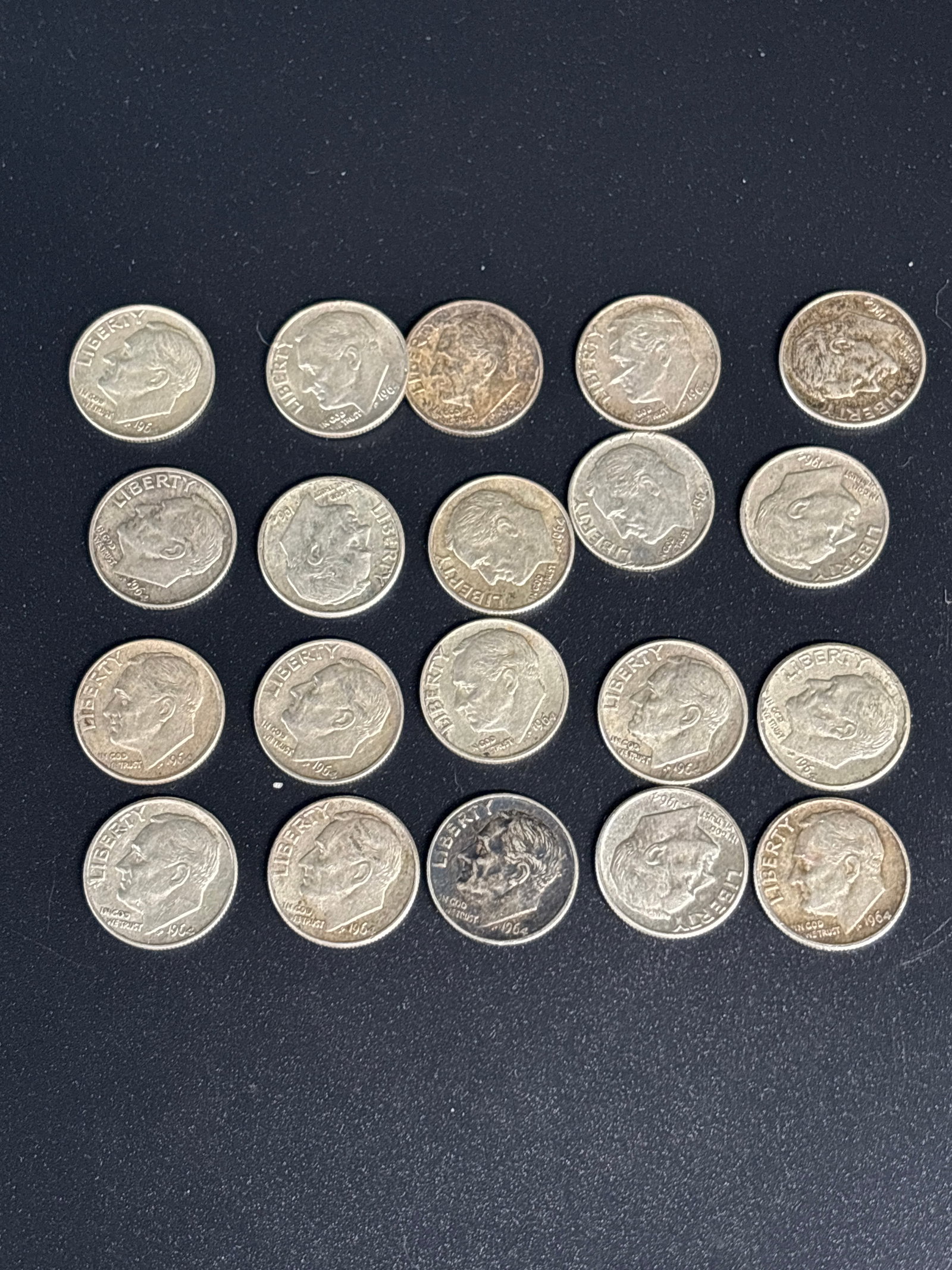 Twenty 1964 United States Washington silver Roosevelt dimes: United States Roosevelt dimes. Silver Composition: Dimes minted in 1964 are composed of 90% silver and 10% copper. Design: The obverse features the bust of President Franklin D. Roosevelt, while the r