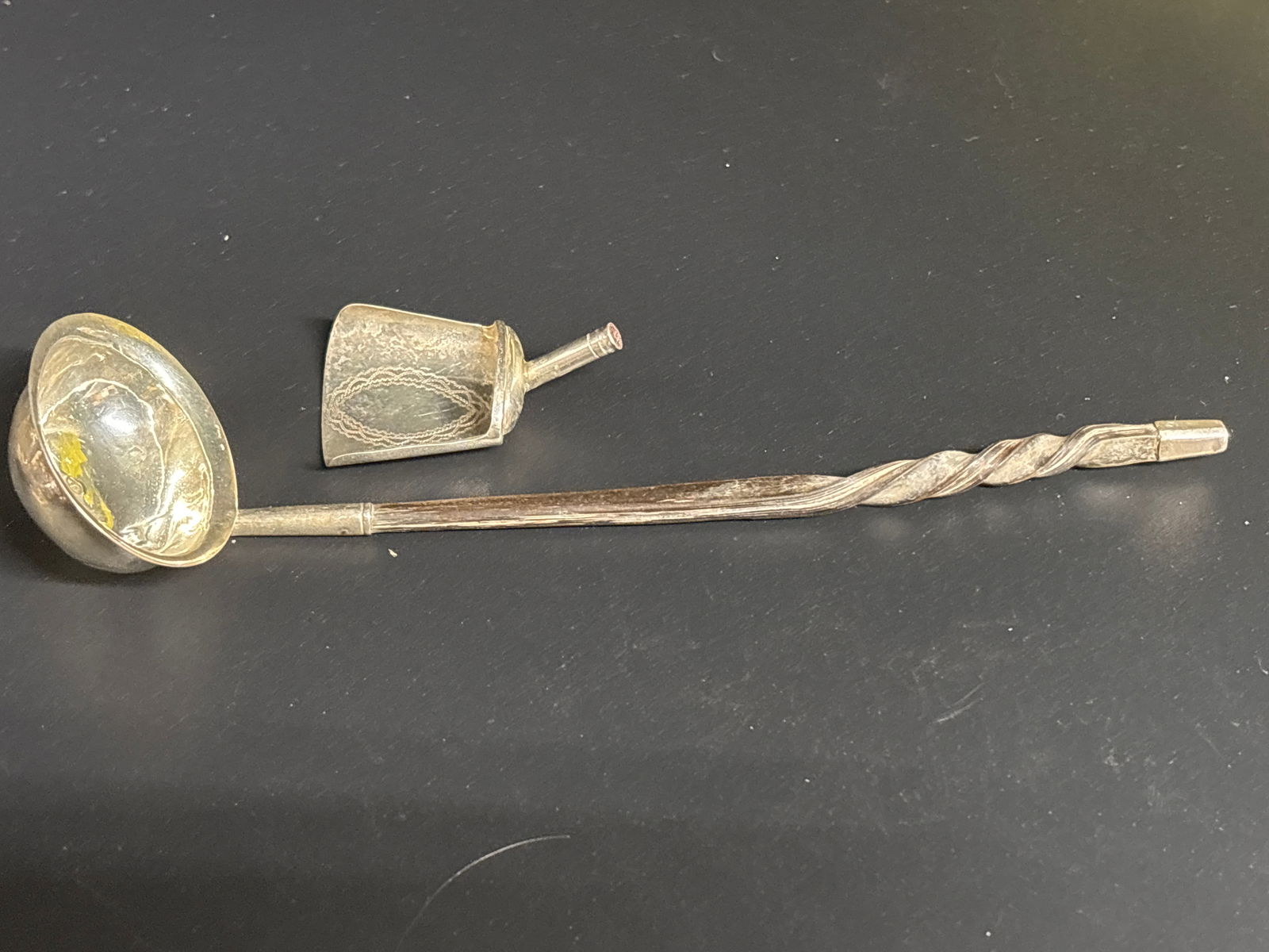 Two 19th C. English sterling silver spoons: William IV silver 7 inch toddy ladle, spiralled horn handle, William Knight II, London 1833, 11.7g gross; a George III caddy spoon, with shovel bowl, I L, Birmingham 1808. One lacking wooden baleen ha