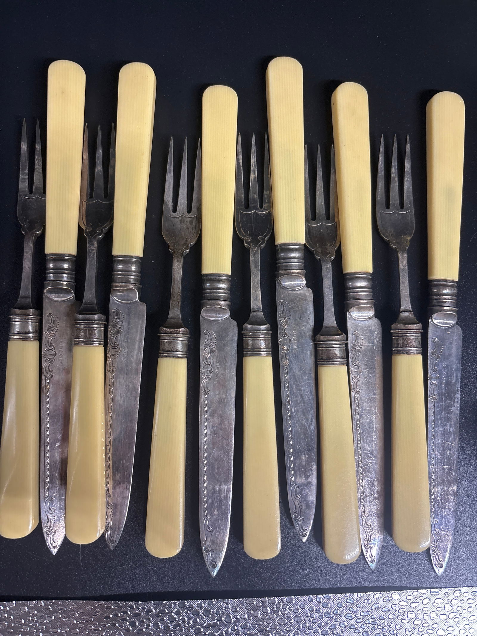 Twelve piece antique English plated silver set with celluloid handles. (1 of 5)