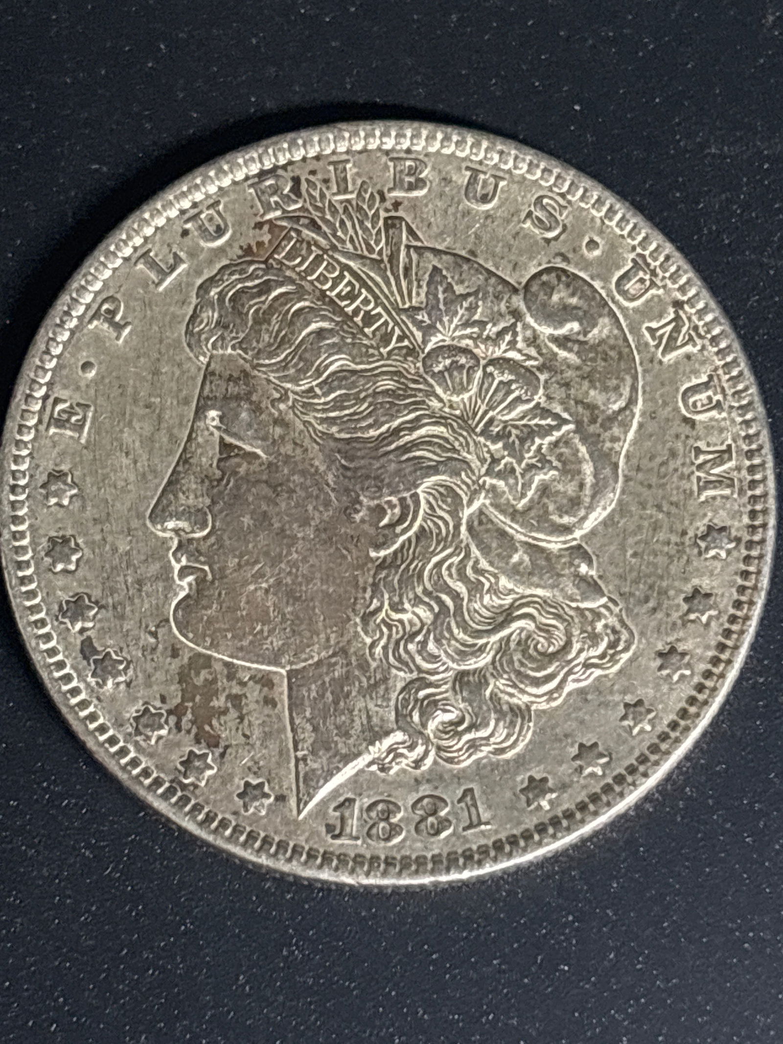 early 1881 original Morgan United States Silver Dollar: 1881 Morgan Silver Dollar.Composition: It is struck from 90% silver and 10% copper. Weight & Purity: Contains approximately 0.7734 troy ounces of pure silver. Historical Context: 1921 was the final ye