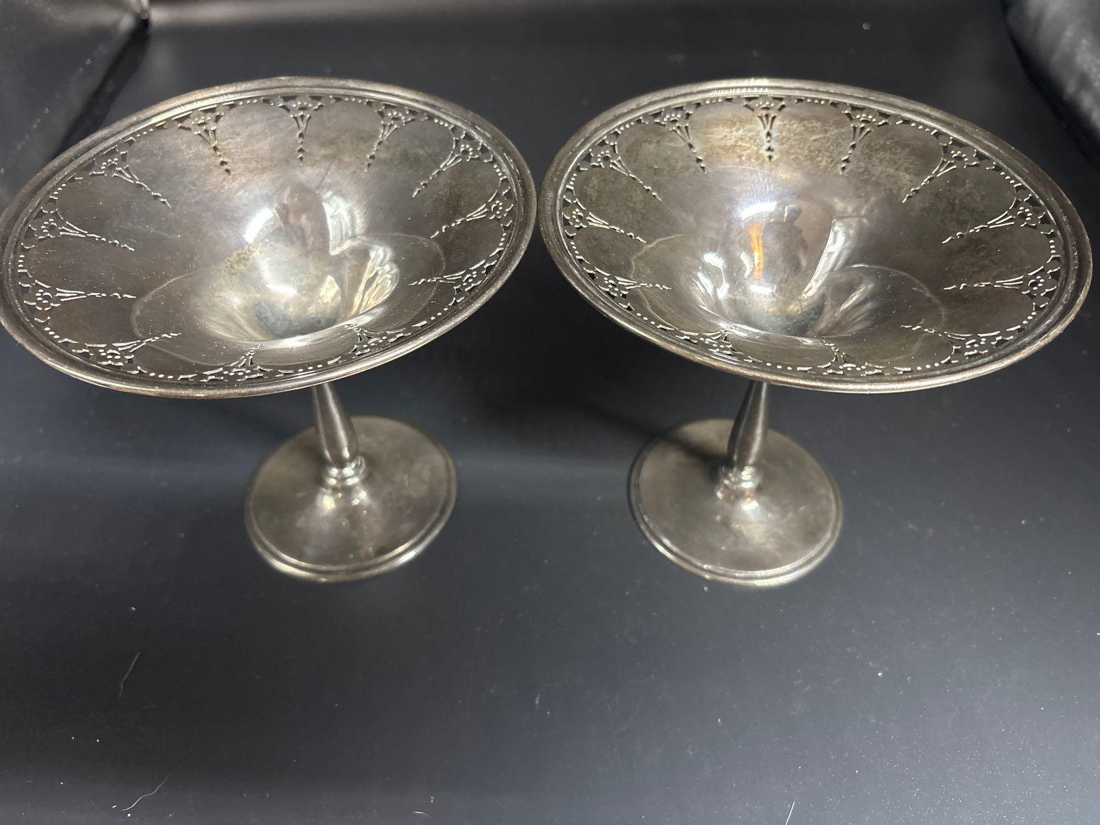 pair Art Deco Tiffany & Co. sterling silver footed compotes or tazza. ; 612 grams: Tiffany & Co. sterling silver footed compote tazza. , as indicated by the hallmarks on the object. The stamps show it is made of sterling silver, which is 925 parts per 1000 pure silver. Brand: Tiffan