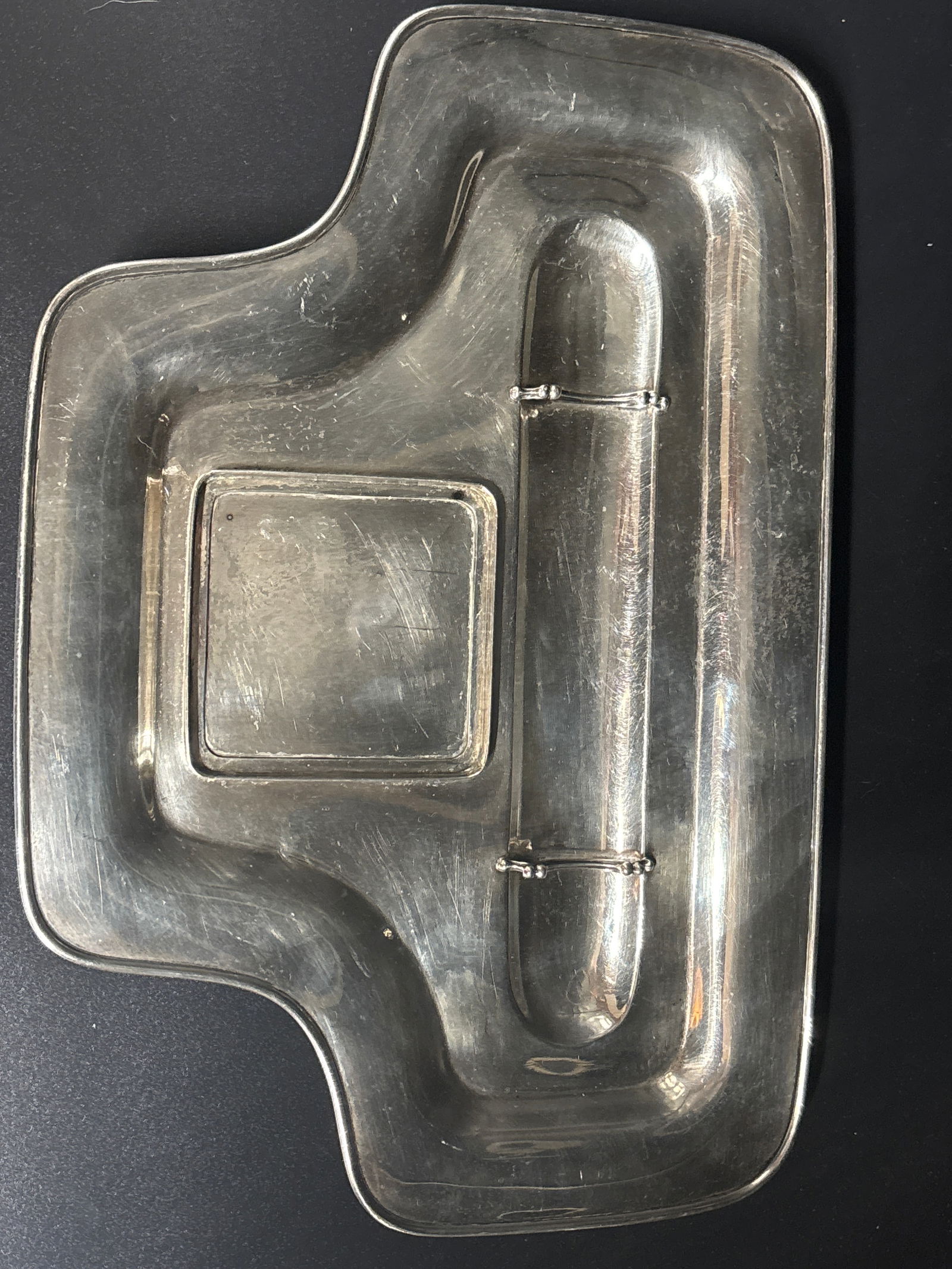 Art Deco Tiffany & Co. sterling silver Desk tray ink standish; 620 grams: Tiffany & Co. Sterling Silver Desk Tray or a related specialty item like a cigar ashtray.Key Identification FeaturesForm & Function: The object appears to be a specialized tray, likely designed for a