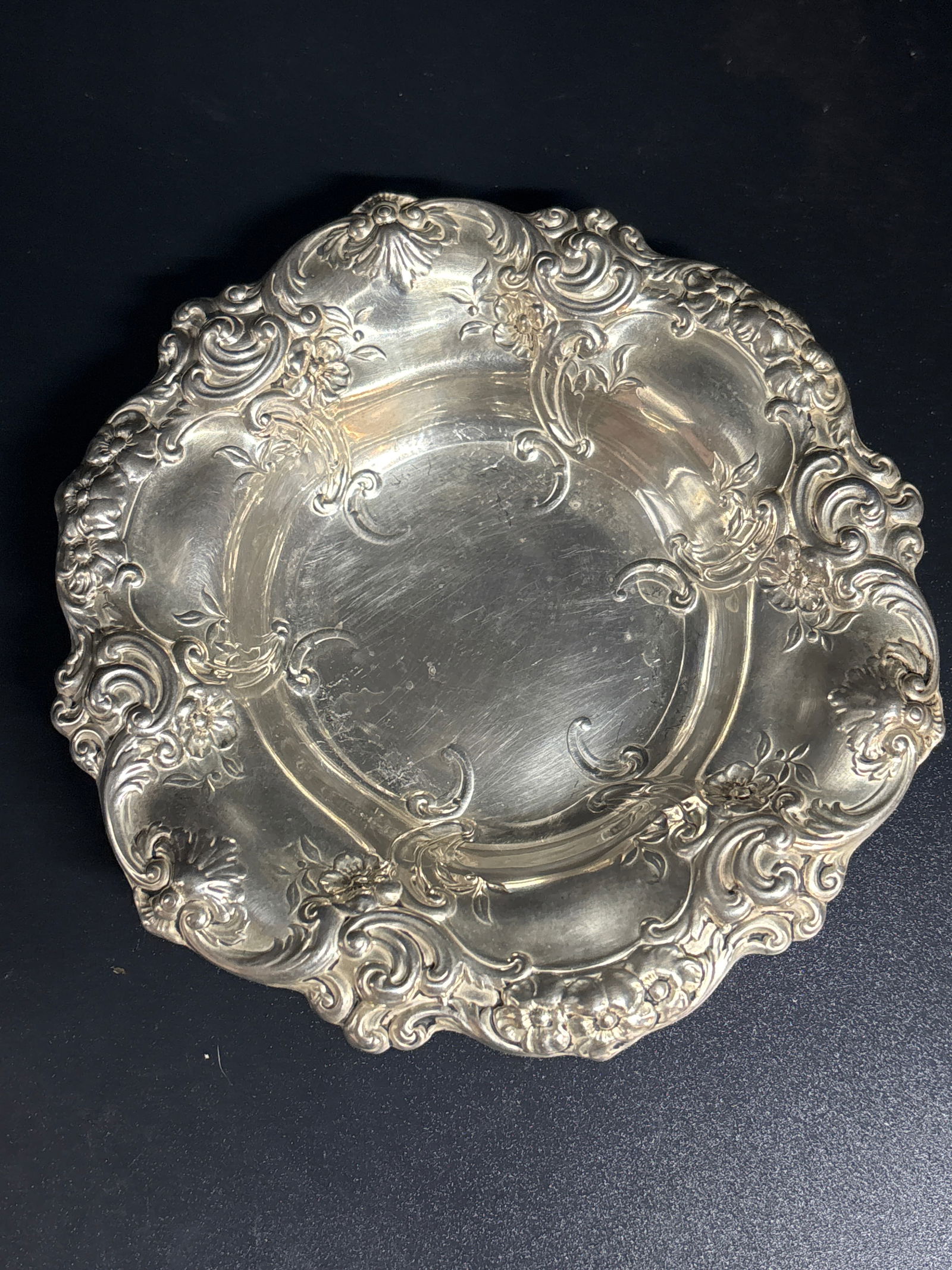 vintage sterling silver 5&1/2 inch bowl by Gorham; 86 grams: vintage sterling silver bowl by Gorham, in the "Melrose" pattern. Material: Sterling silver.Design: Ornate floral and scroll repoussé border.Dimensions: Typically measures around 5&1/2 inches in diam