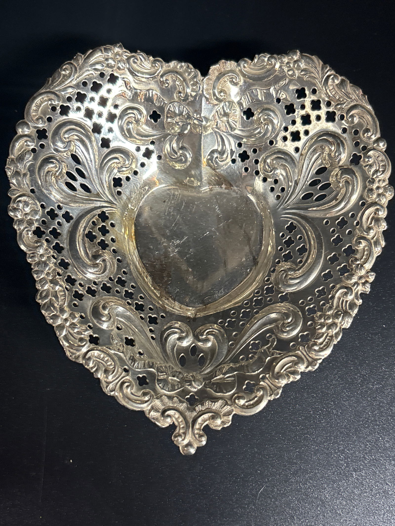vintage Gorham sterling silver 5 inch heart-shaped candy ; 72 grams: vintage Gorham sterling silver heart-shaped candy dish. Manufacturer: Gorham Manufacturing Company. Pattern: Often associated with the "Chantilly" pattern, though specific model numbers like #966 or #