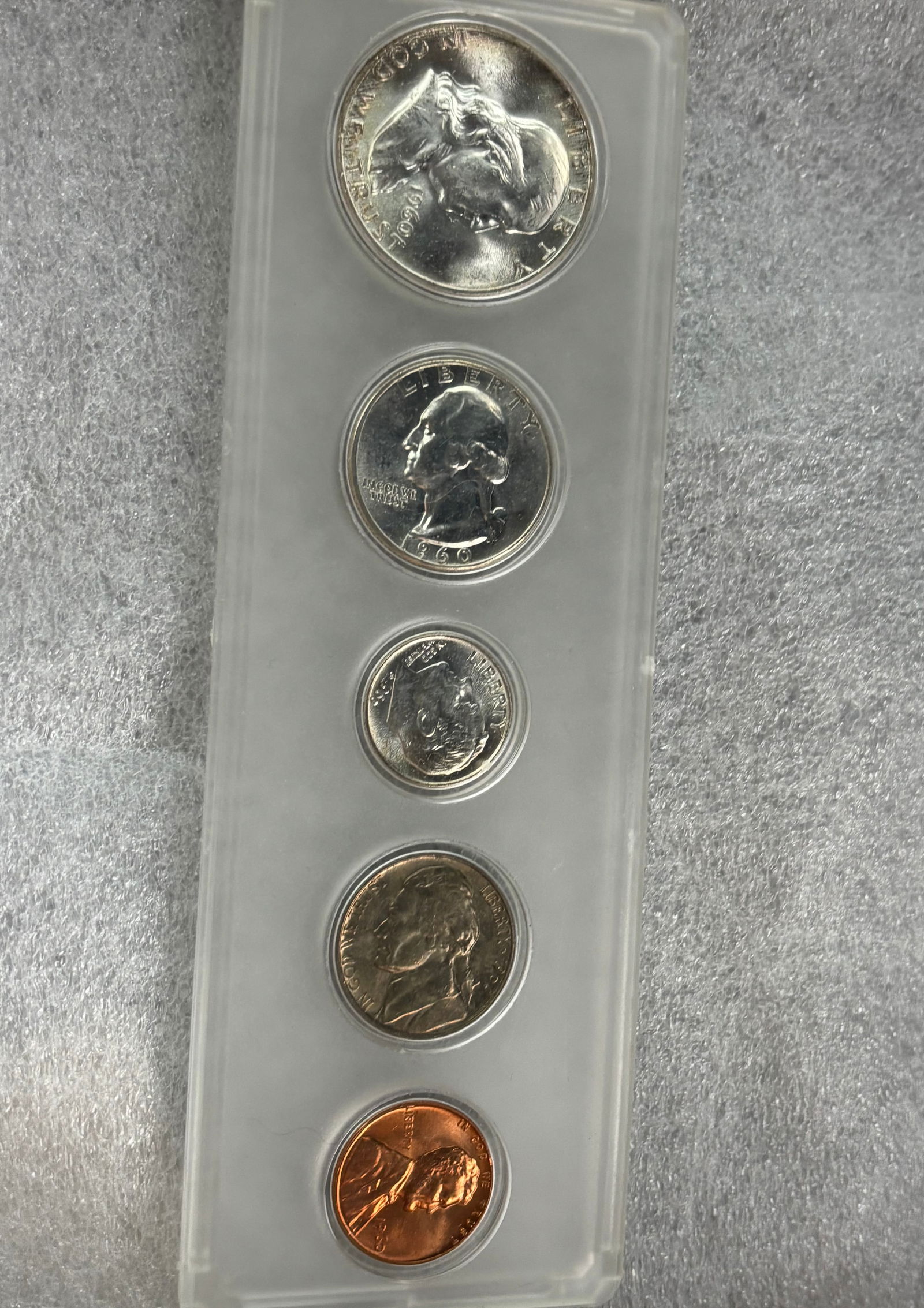 1960 Franklin silver United States Proof Set packaged: United States Proof Set packaged in plastic holder, containing a Franklin half dollar, Washington quarter, Roosevelt dime, Jefferson nickel, and Lincoln cent. Silver Content: The half dollar, quarter,