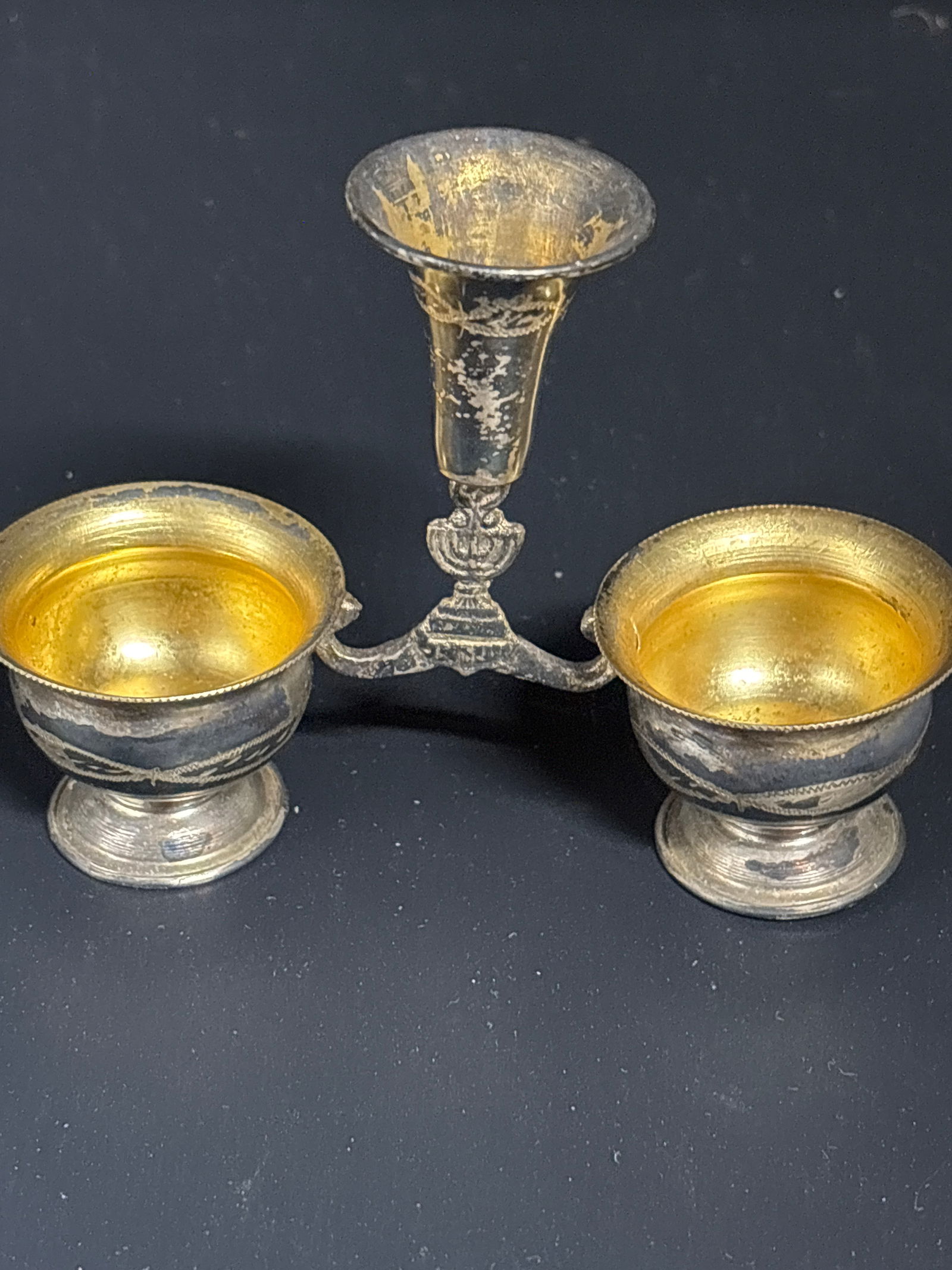 vintage European .800 silver double salt cellar and holder; 43 grams: vintage, likely European double salt cellar and holder, often featuring a gilded interior and a decorative central stand. It typically dates from the late 19th to mid-20th century, often marked with s