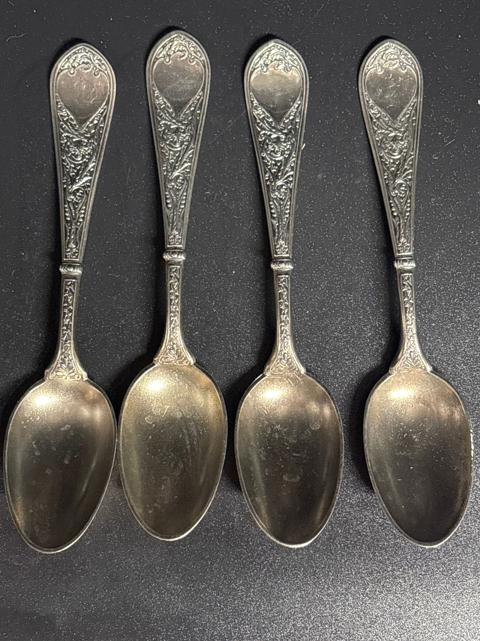 Set of four antique sterling silver teaspoons in the "Raphael" pattern,5 inch; 74 grams: Patent date 1874. No monogram.Set of four antique sterling silver teaspoons in the "Raphael" pattern produced by the Gorham Manufacturing Company, with production dating back to around 1875. Pattern: