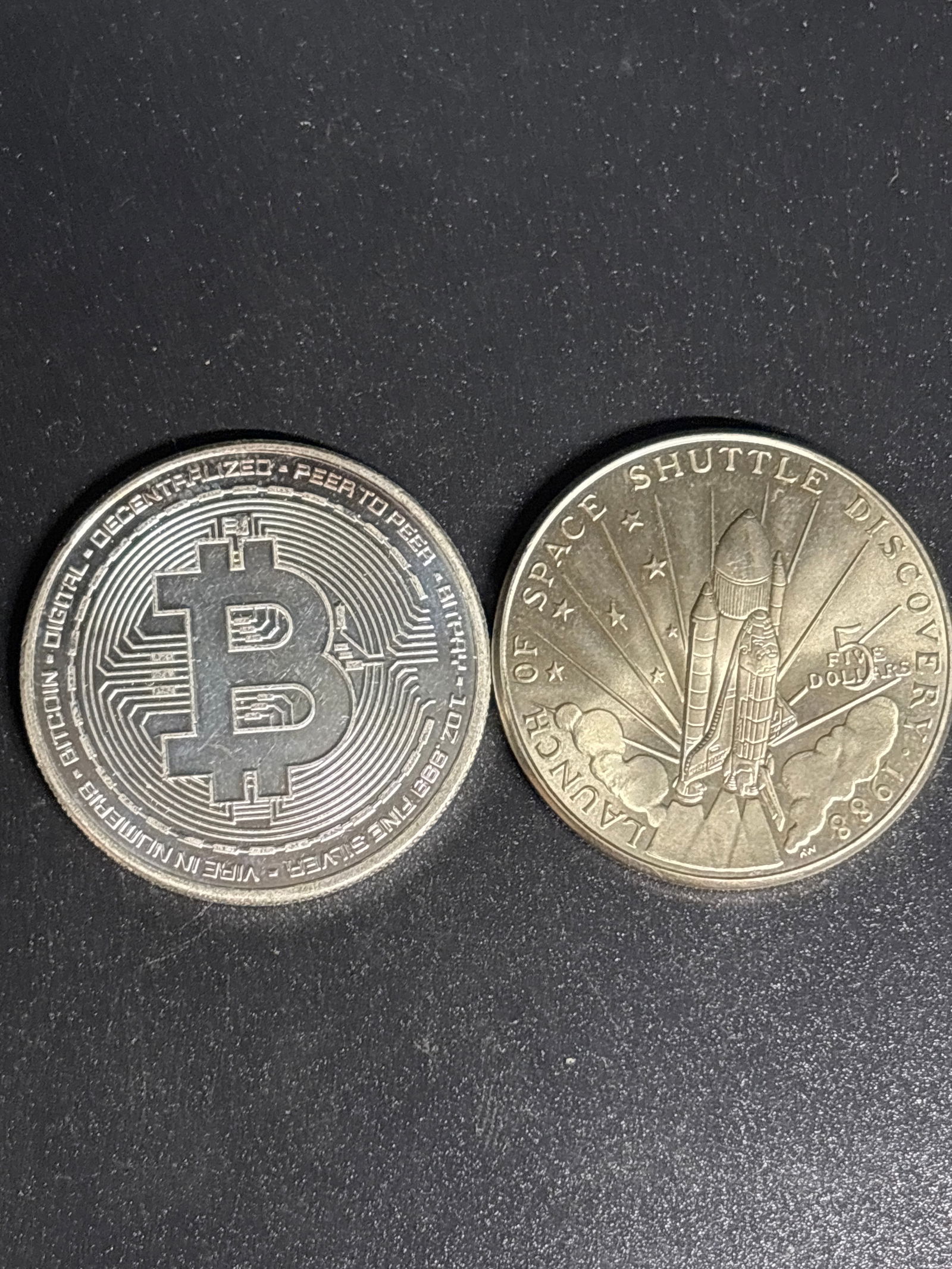 one ounce .999 fine silver 2022 physical Bitcoin coin & clad $5 coin: 2022 physical Bitcoin commemorative coin, often minted by private companies as a collectible piece. Material: Contains 1 troy ounce of .999 fine silver. Design: Features the Bitcoin symbol surrounded
