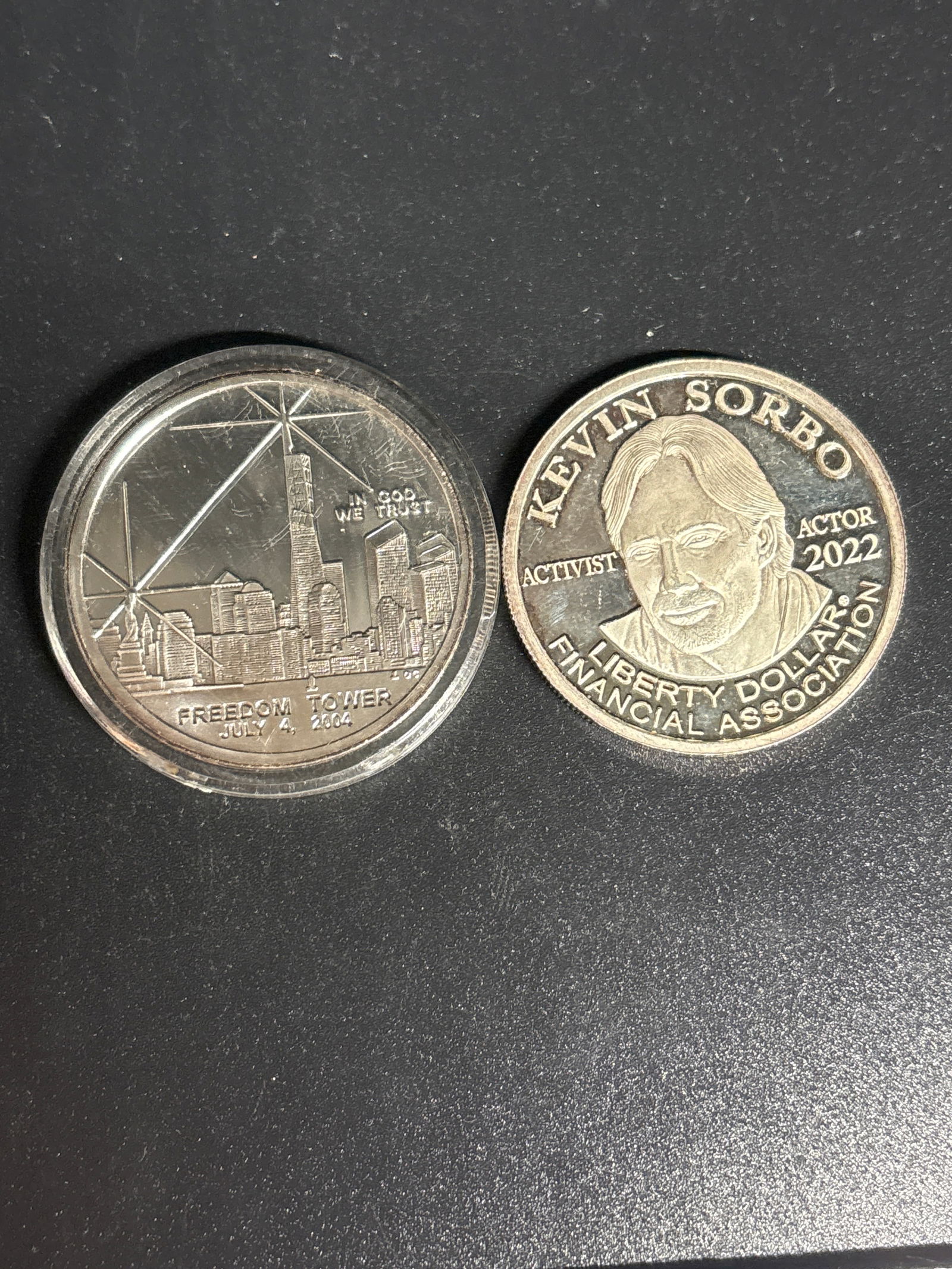 one ounce .999 fine silver 2022 Kevin Sorbo Liberty Dollar & clad $1coin: 2022 Kevin Sorbo Liberty Dollar commemorative coin featuring a portrait of actor Kevin Sorbo.It is labeled with "KEVIN SORBO," "ACTIVIST," "ACTOR 2022," and "FINANCIAL ASSOCIATION LIBERTY