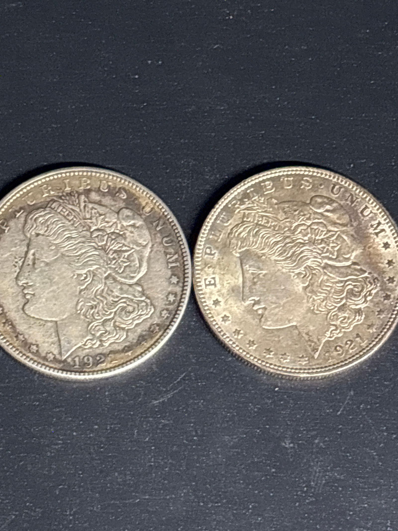 Two original 1921 Morgan United States Silver Dollar.: Two 1921 Morgan Silver Dollars.Composition: It is made of 90% silver and 10% copper, containing 0.77345 troy ounces of pure silver. Design: The obverse features a profile portrait representing Lady Li