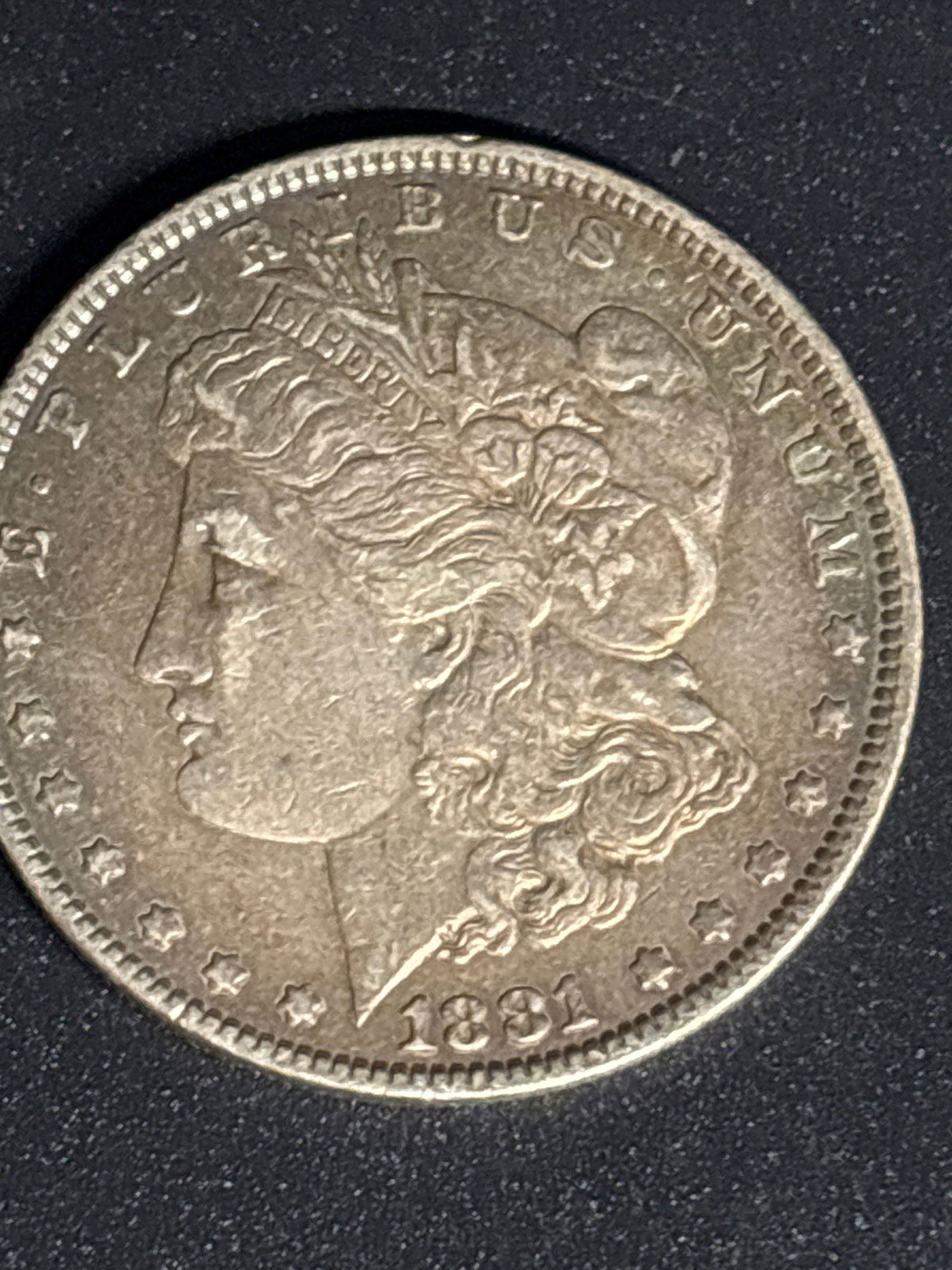 Early dated 1881 United States Morgan Silver Dollar: 1881 United States Morgan Silver Dollar, which was minted between 1878 and 1921. Designer: George T. Morgan.Composition: 90% silver and 10% copper.Weight: 26.73 grams.Diameter: 38.1 mm.