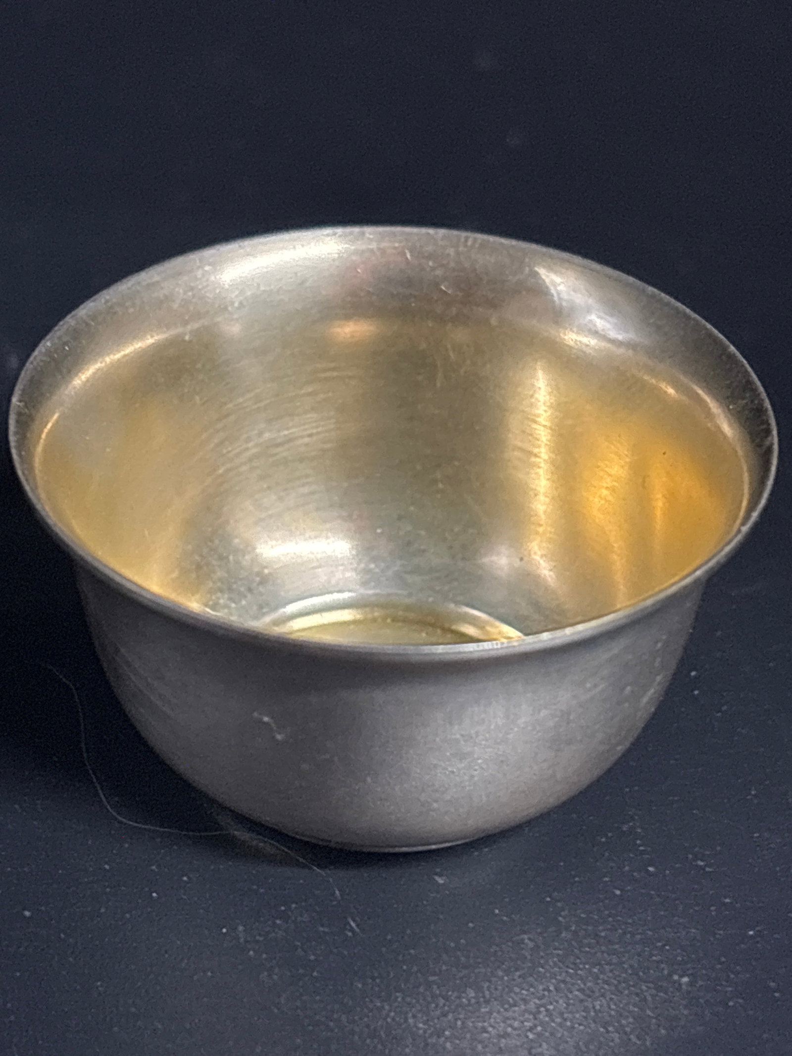 Vintage Tiffany & Co. sterling silver partial gilt salt cellar; 22grams: Tiffany & Co. sterling silver partial gilt salt cellar. Material and Finish: The bowl is made of sterling silver, and its interior has a gold wash (gilding). The gold wash serves to protect the silver