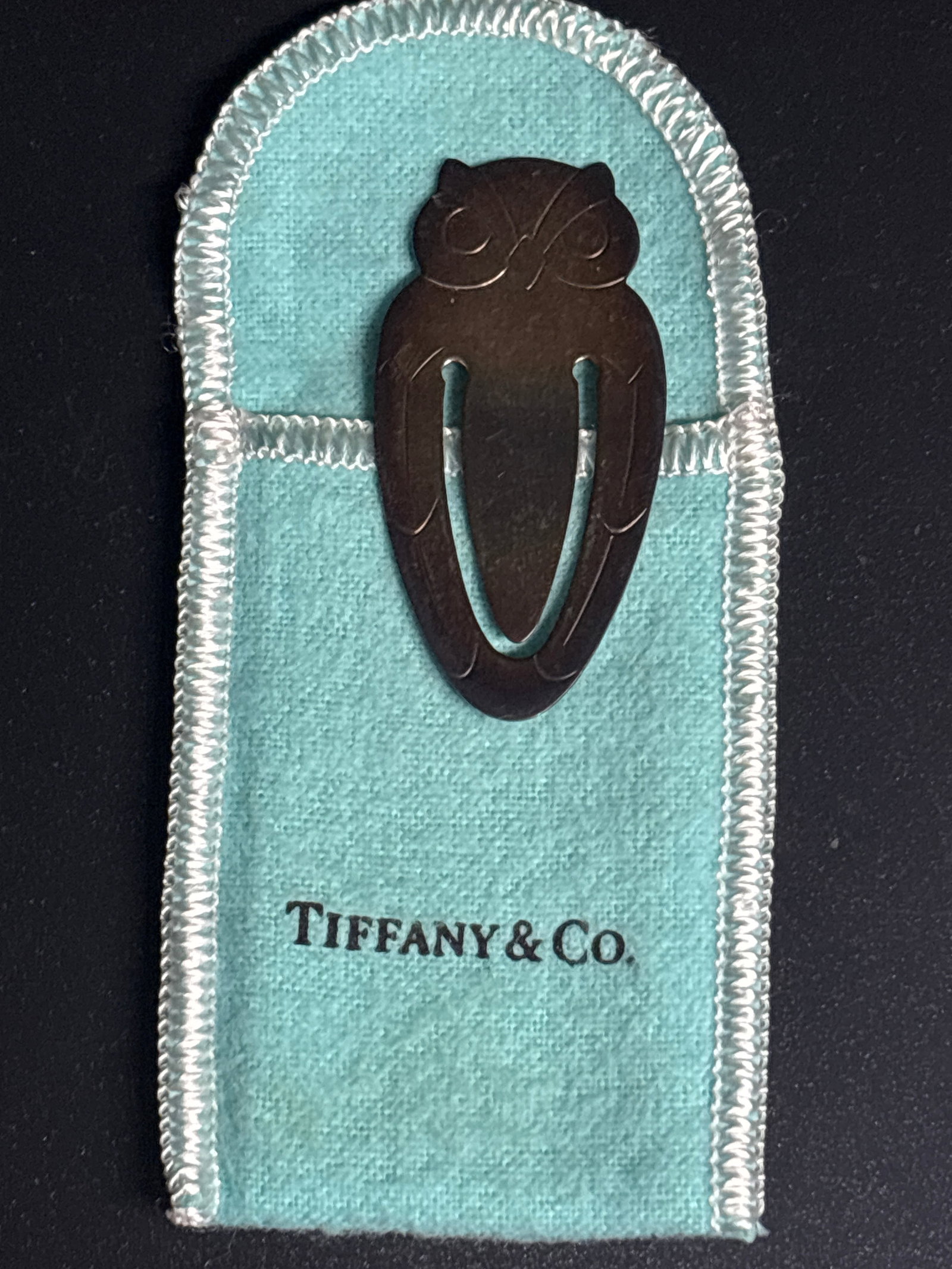 Vintage Tiffany & Co. sterling silver 2 inch owl form bookmark; 5 grams: Tiffany & Co. sterling silver owl bookmark. It features a stylized, modernist design of an owl and is typically marked "Tiffany & Co. Sterling" on the reverse side.Product DetailsBrand: Tiffany & Co.M