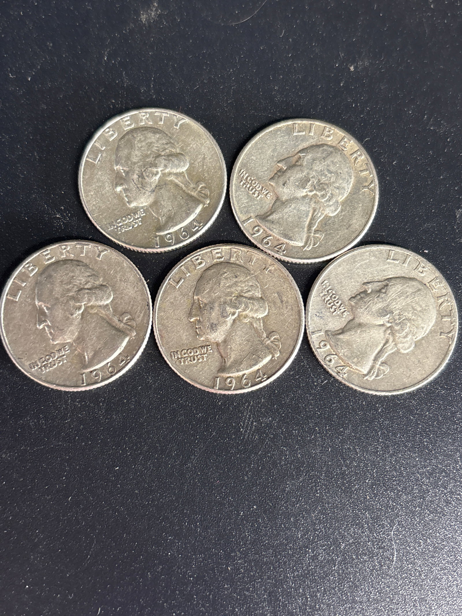 Five 1964 Washington United States silver quarters: Five 1964 is significant for the Washington quarter because it was the last year these coins were produced with 90% silver for circulation. Composition: The 1964 Washington quarter is composed of 90% 