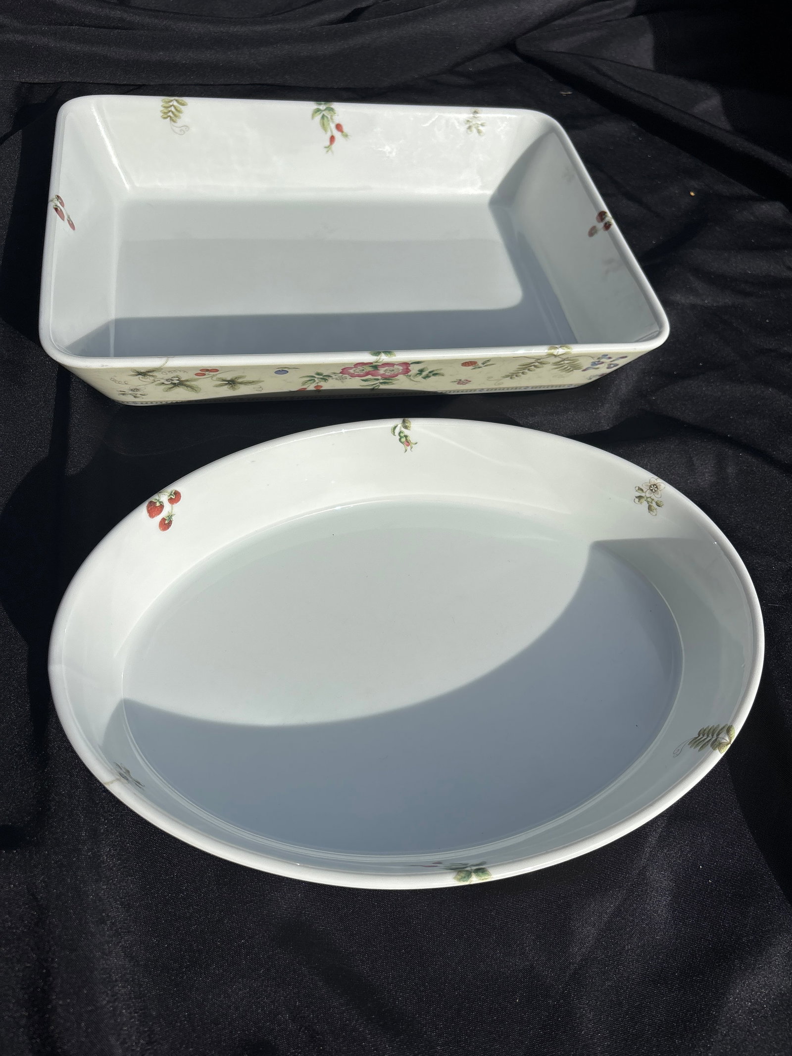 Two large serving bowls Wedgwood in the Fleur pattern set of eight 9inch: 11&1/2 oval serving bowl & rectangular 9&1/2 serving piece. Wedgwood pin the Fleur pattern.Pattern DetailsThe Fleur pattern features a delicate design of pink and white flowers along with various frui