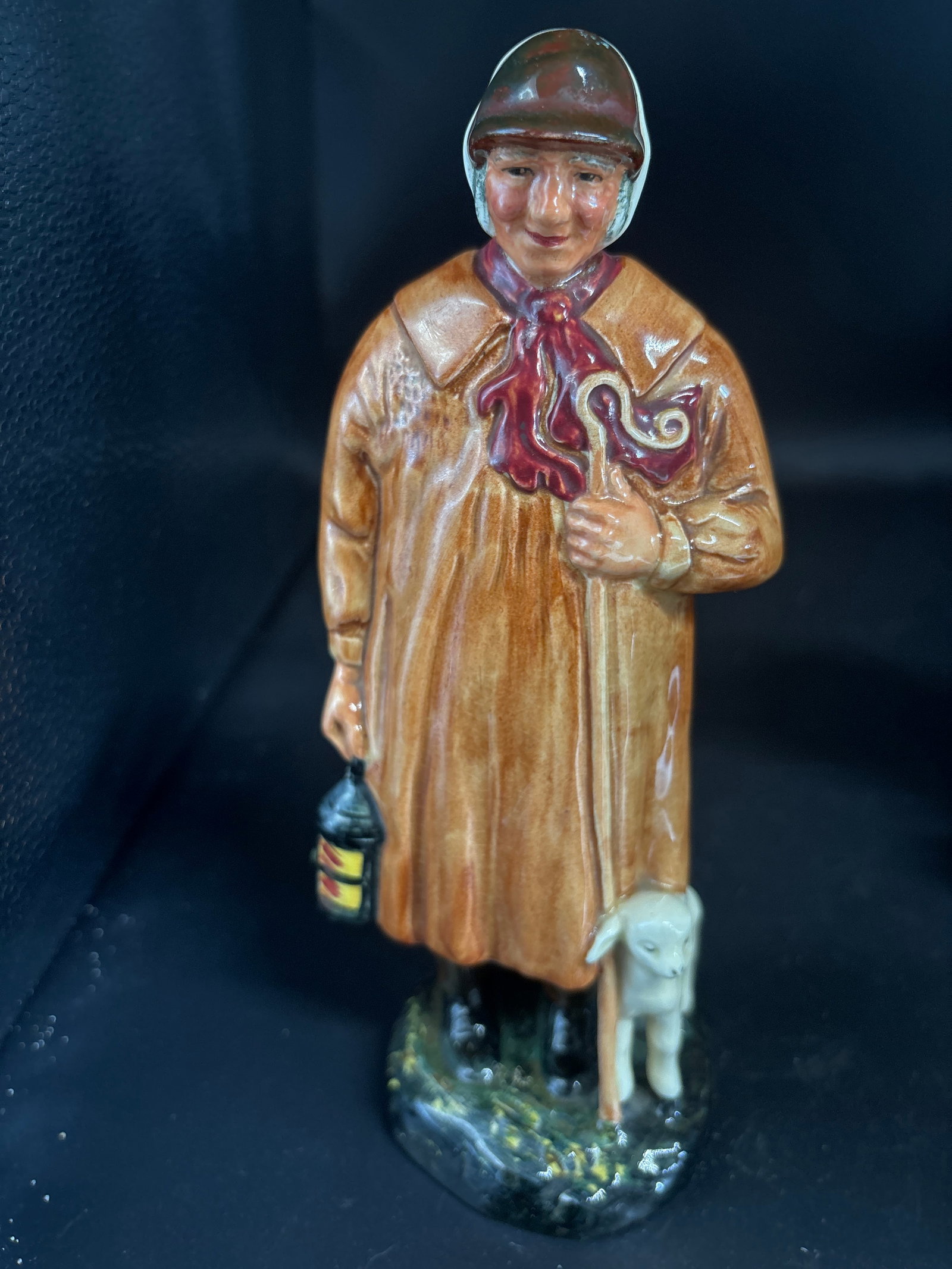 Royal Doulton 8.5 inch figurine titled "The Shepherd" (model number HN1975): Royal Doulton piece titled "The Shepherd," model number HN 1975.Figurine DetailsManufacturer: Royal Doulton, a renowned English fine porcelain and bone china company.Designer: This specific figurine w