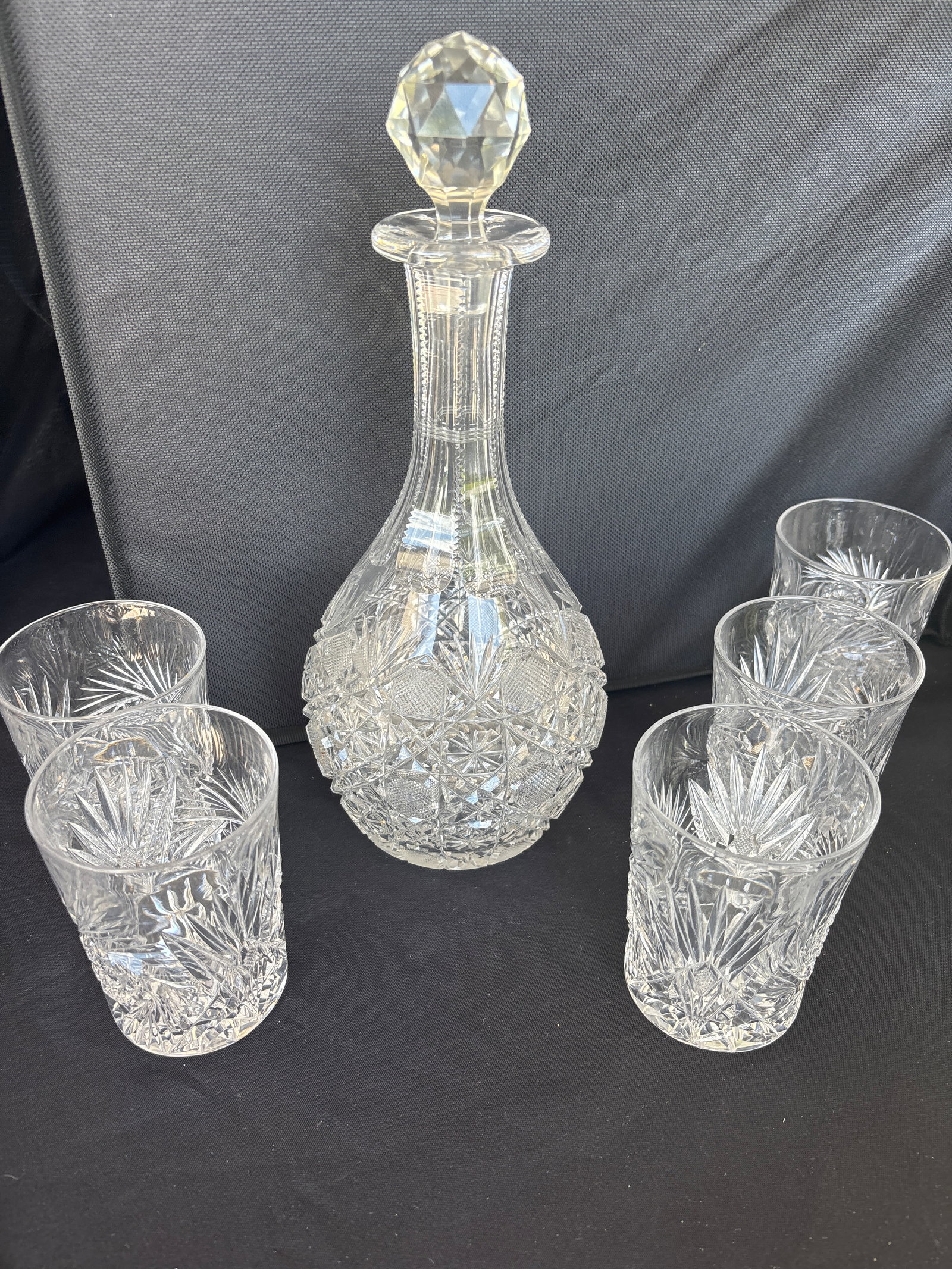 antique 11 inch vintage cut crystal glass decanter & five similar glasses: vintage cut crystal glass decanter & five similar glasses. featuring intricate diamond and star-cut patterns. Material: Lead crystal glass. Design: Intricate hand-cut patterns including starbursts and