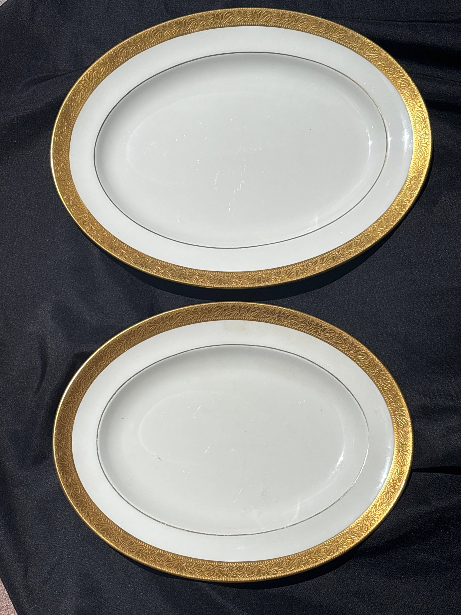 Wedgwood Ascot White & Gold, large serving platters: Wedgwood Ascot gold-encrusted serving platter. This pattern features a wide, ornate gold band on a white background and was produced between 1964 and 1991.Based on your image, this is likely the 13" o