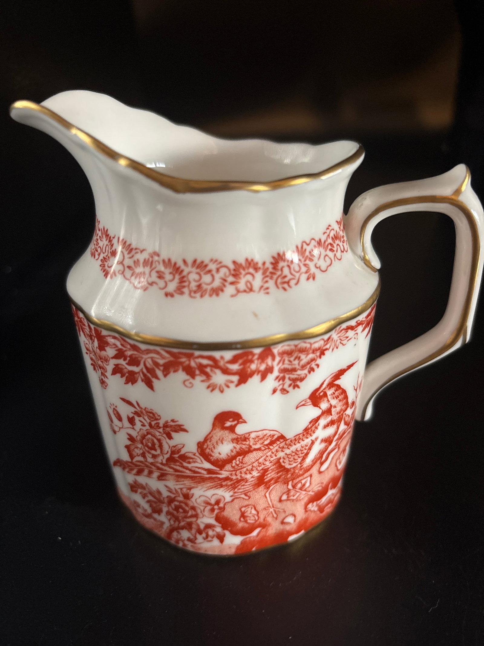 Royal Crown Derby porcelain 4&1/2 inch cream jugclassic Red Aves pattern: Royal Crown Derby porcelain cream jug featuring the classic Red Aves pattern.The Red Aves design is one of Royal Crown Derby's most recognizable patterns, known for its intricate red "transferware"