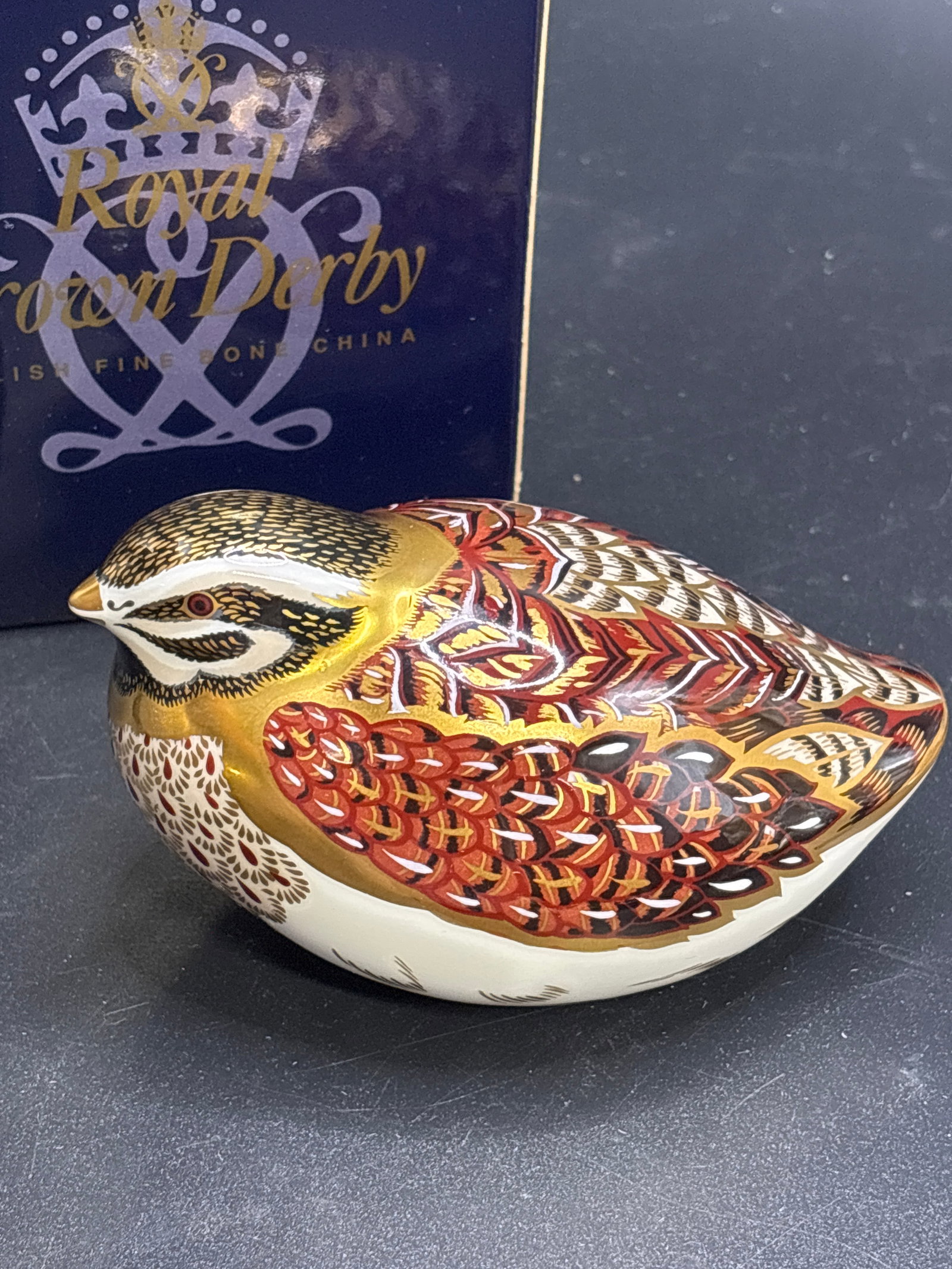 Royal Crown Derby Dappled Quail 4 inches Paperweight: Royal Crown Derby Dappled Quail paperweight. It is a collectible bone china figurine hand-painted with the brand's signature Imari-style patterns and finished with 22ct gold.Product DetailsHeight: