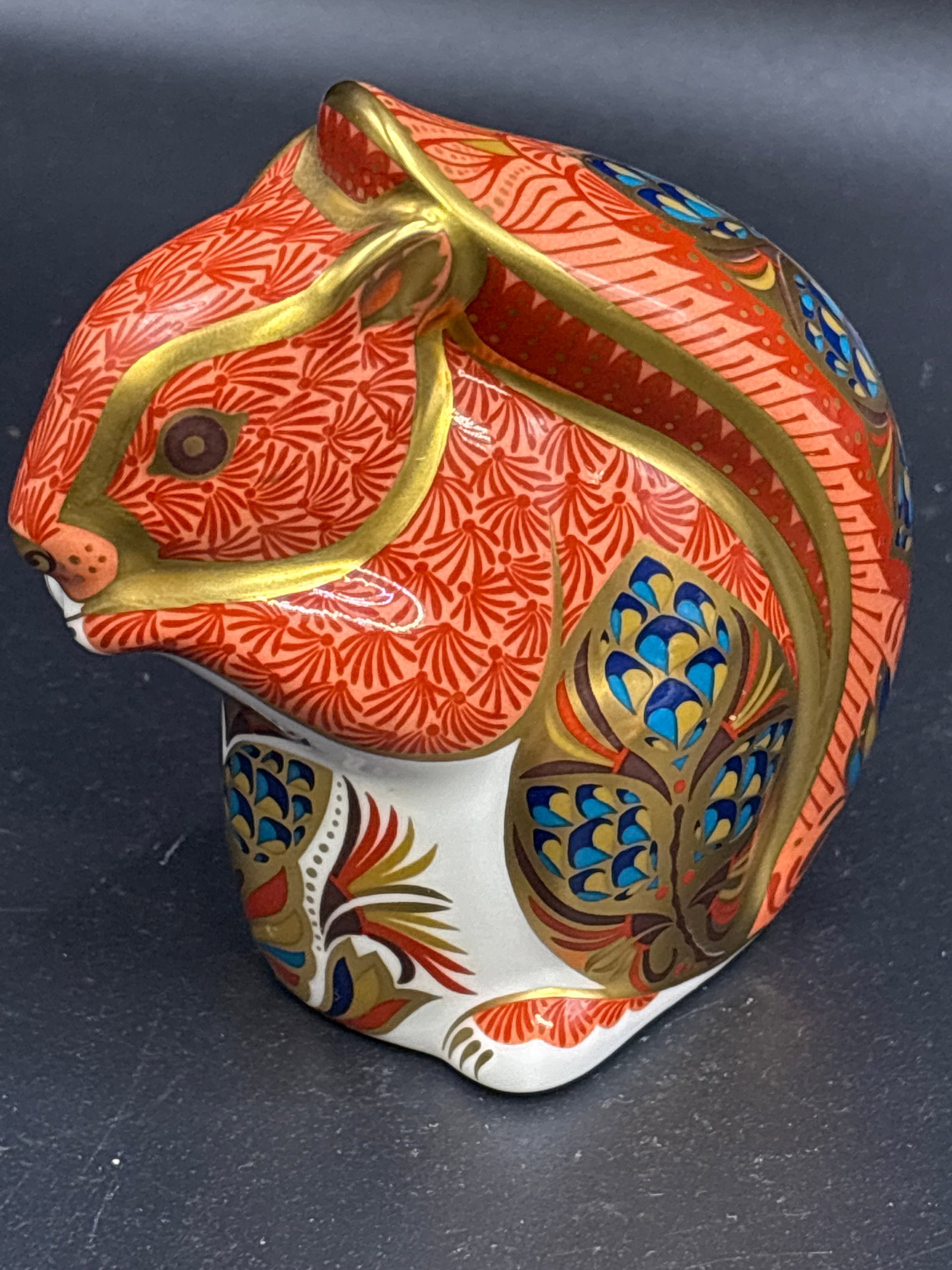 Nice 3.5 inch Royal Crown Derby Red squirrel paperweight: Gold stopper, no box. Royal Crown Derby Red Squirrel fine bone china paperweight.This collectible figurine features the brand's signature Imari style with hand-painted patterns in orange, cobalt blue,