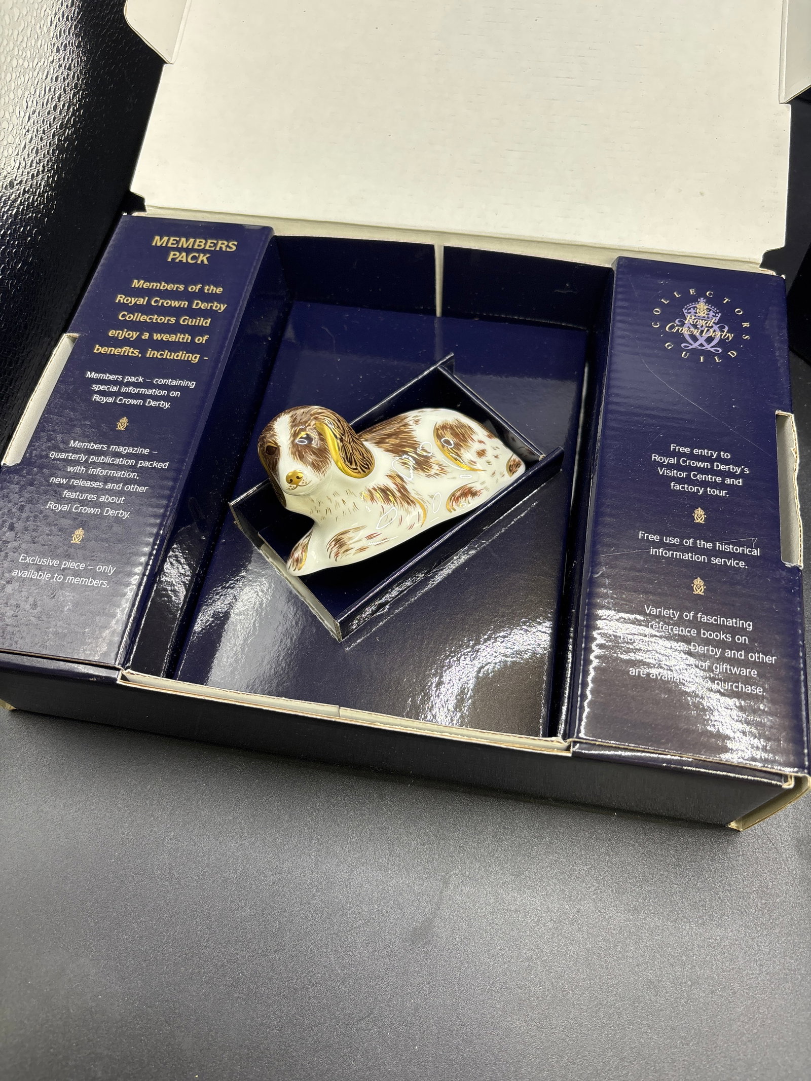 Collectors Guild ‘Scruff’ dog Royal Crown Derby bone china paperweight: Scruff paperweight, a specialty piece created by Royal Crown Derby. It was released in 2006 as an exclusive item for members of the Royal Crown Derby Collectors Guild.Product DetailsDesign: The patter