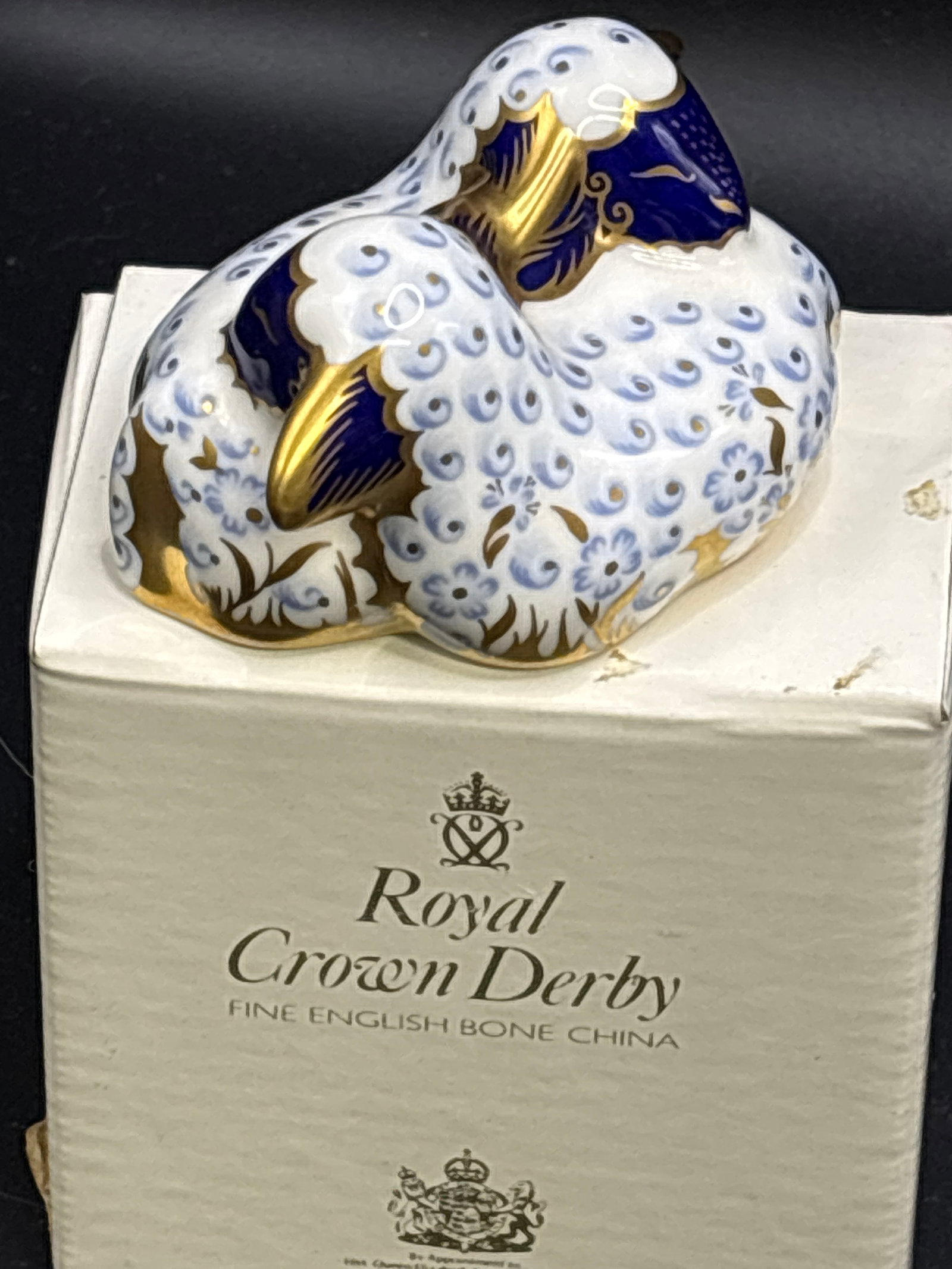 Twin lambs Royal Crown Derby bone china 3 inch paperweight: First Quality. Gold stopper. With box. Royal Crown Derby Twin Lamb paperweight. Made from fine bone china in England, it features a distinctive pattern inspired by traditional Imari designs, often acc