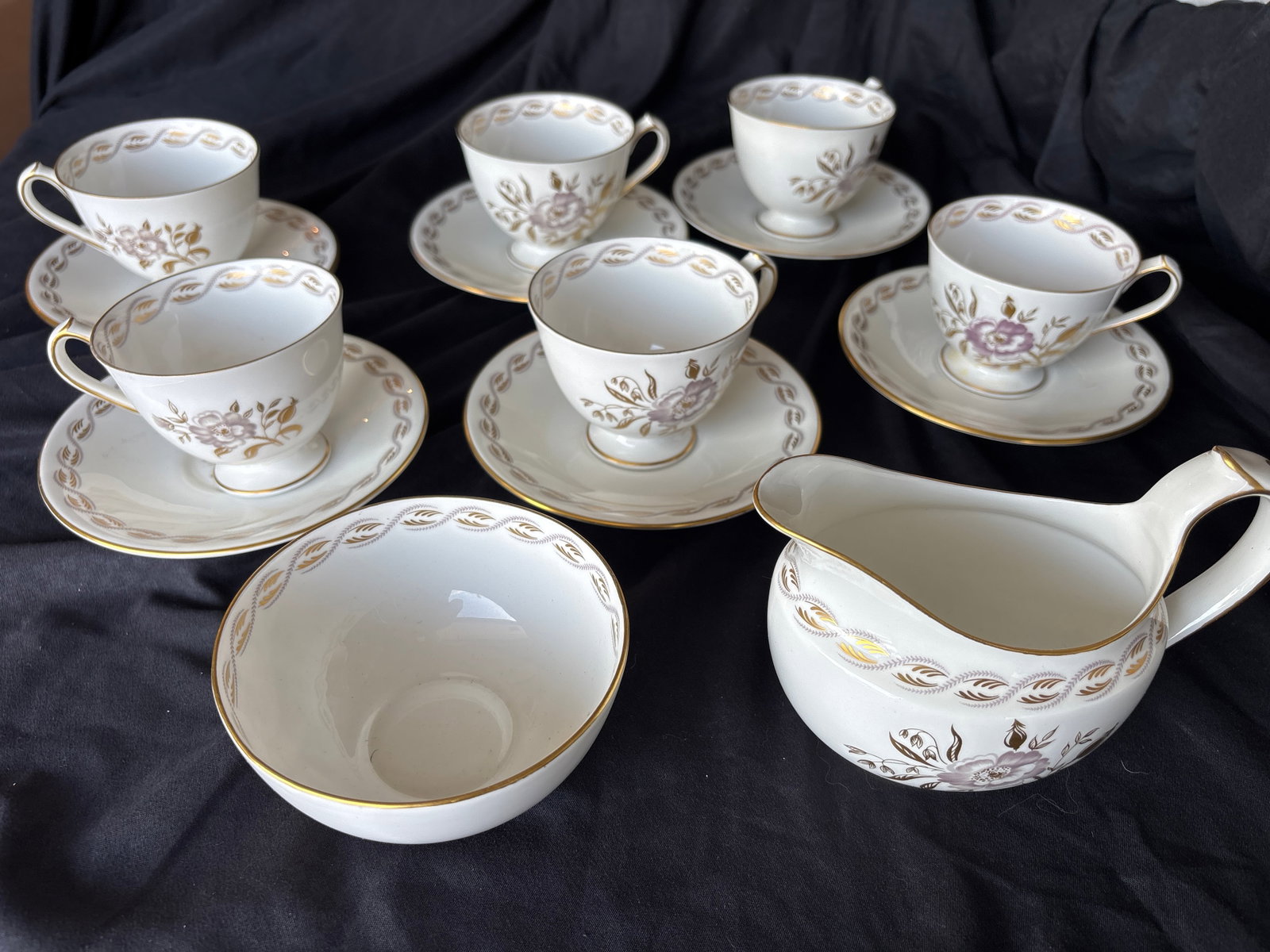 Fourteen piece ‘Harvest Poppy’ Royal Crown Derby tea set: Fourteen piece Early Royal Crown Derby tea set.Harvest Poppy pattern by Royal Crown Derby.This vintage fine bone china design features a delicate pink and purple floral center accented by gold leaves.