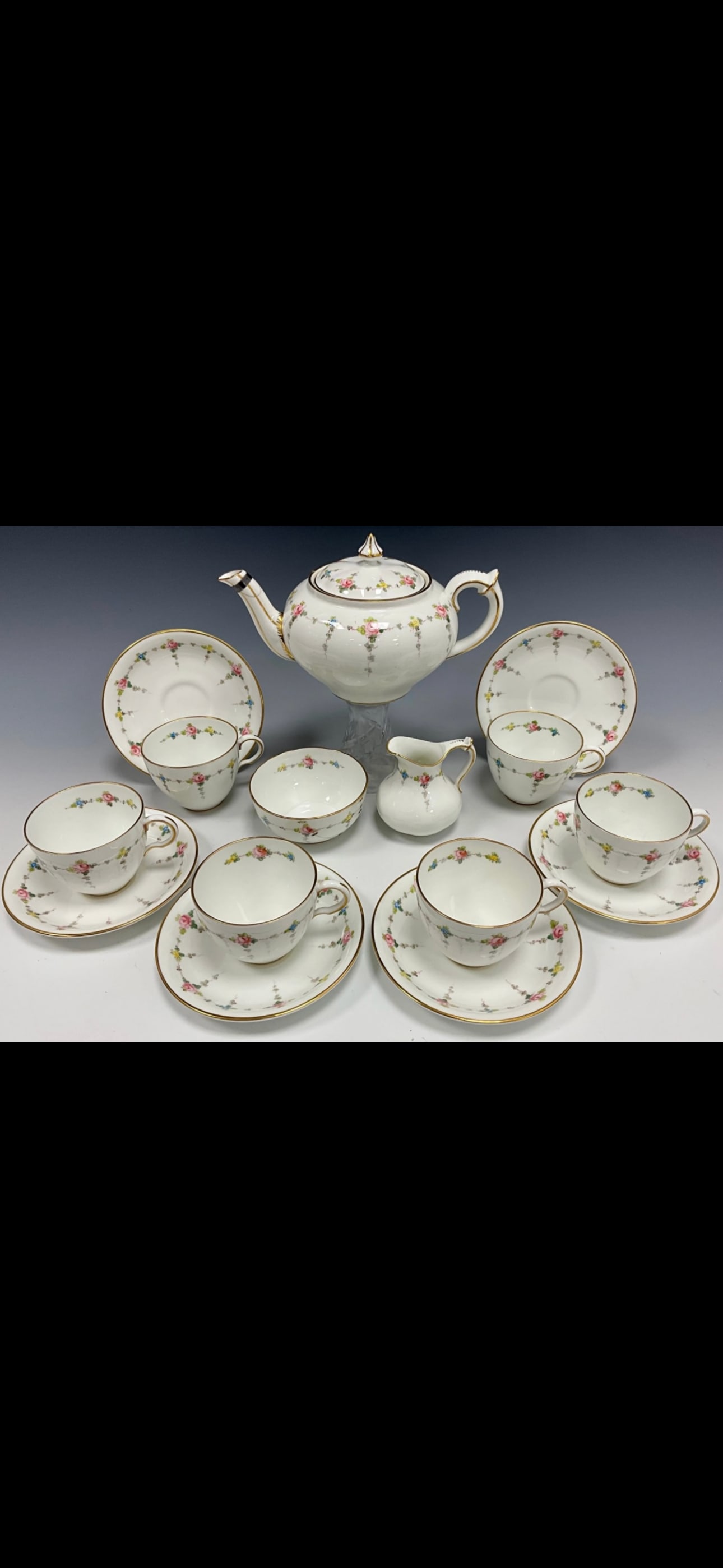 Royal Crown: Royal Crown Derby Pattern 8744, a refined Art Nouveau design often dated back to around 1912. Pattern DetailsDesign: It is characterized by delicate, hand-painted swags of pink roses intertwined with 