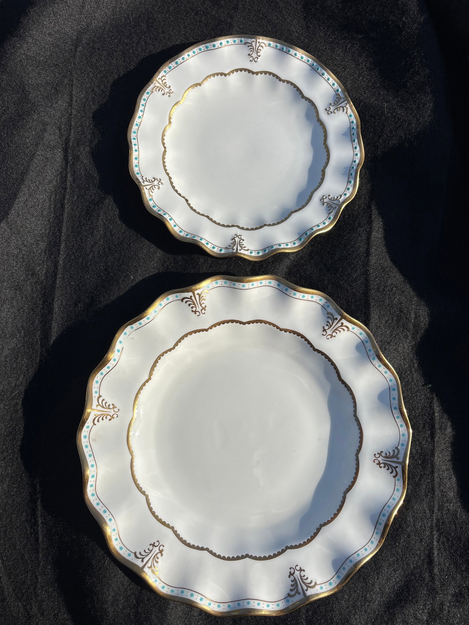 Two wavy edge "Lombardy" pattern plates from Royal Crown Derby: Two wavy edge "Lombardy" pattern from Royal Crown Derby. This elegant pattern is characterized by a "Royal Shape" with scalloped, ruffled edges, detailed gold scrolls, and distinctive turquoise (aqua)
