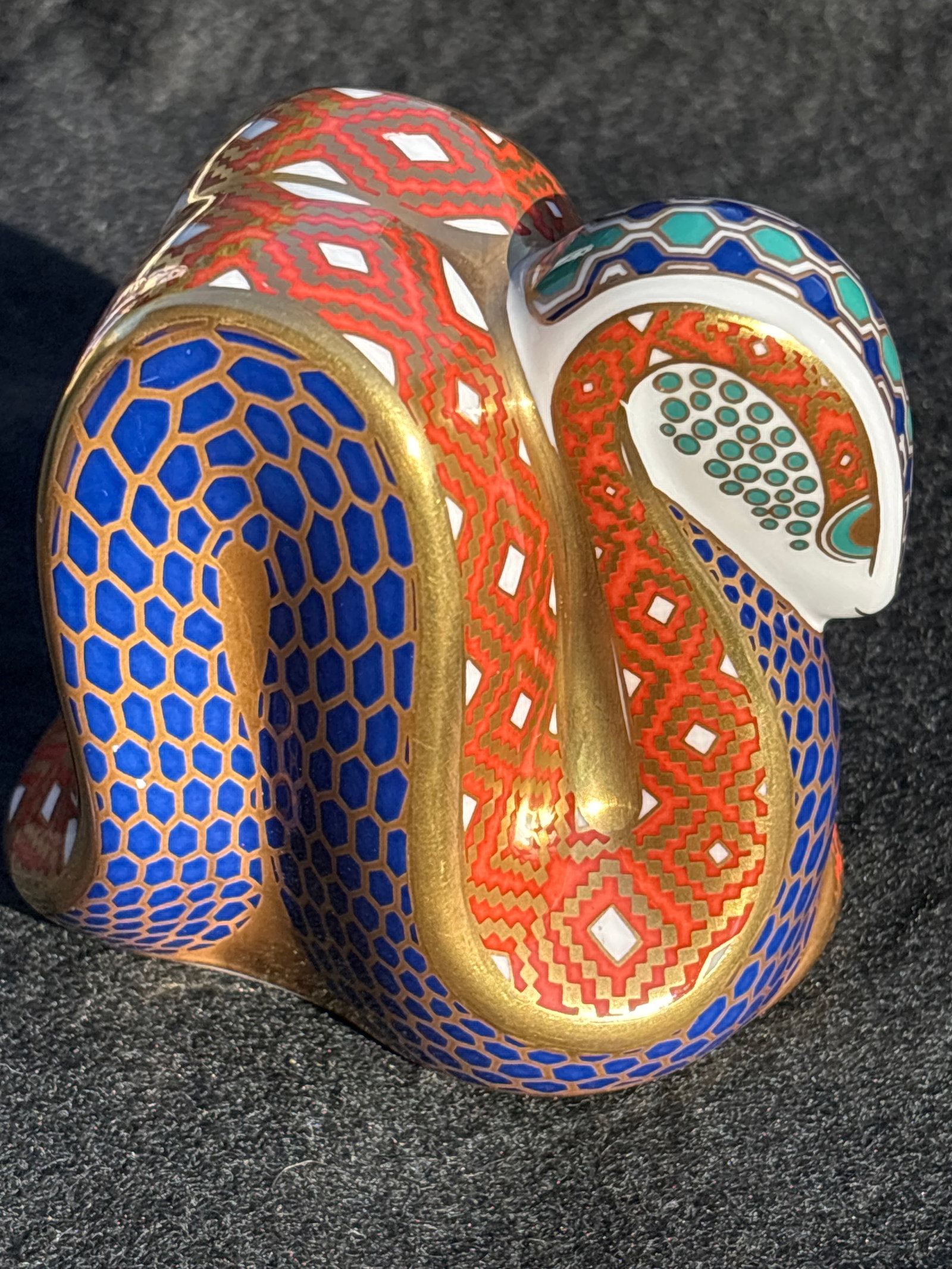 fabulous Royal Crown Derby Imari Snake bone china 3&1/2 inch paperweight: Gold stopper. No box. Royal Crown Derby Imari Snake porcelain paperweight with 22ct gold gilding and a gold stopper. Design: It features a signature "Imari" palette with cobalt blue honeycomb scales a