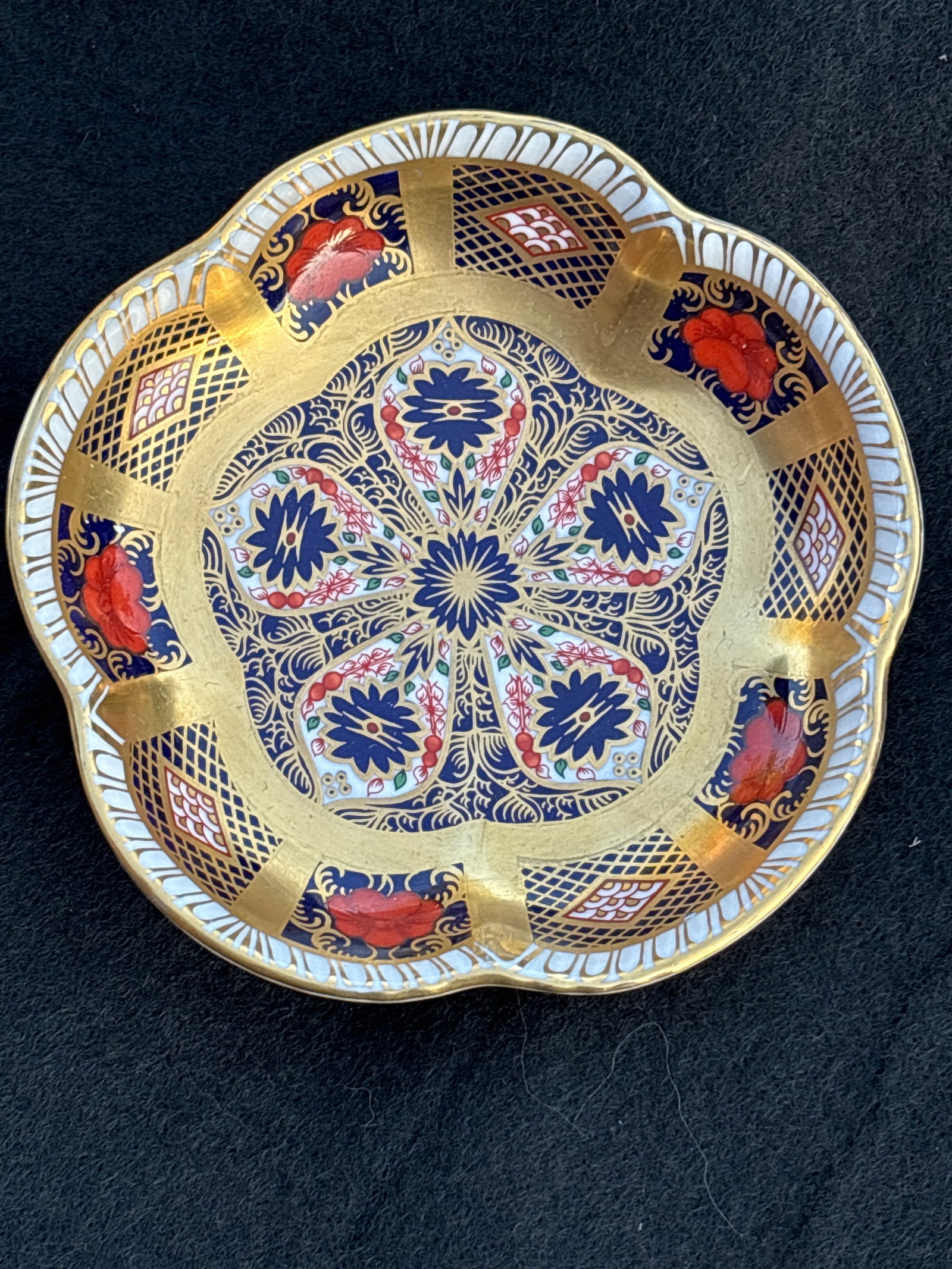 Gold band Royal Crown Derby "Old Imari#1128 4.5 inch trinket dish: Royal Crown Derby "Old Imari" trinket dish, recognized by its distinctive Pattern 1128 design. This pattern is one of the most famous and enduring designs from the historic English manufacturer, featu