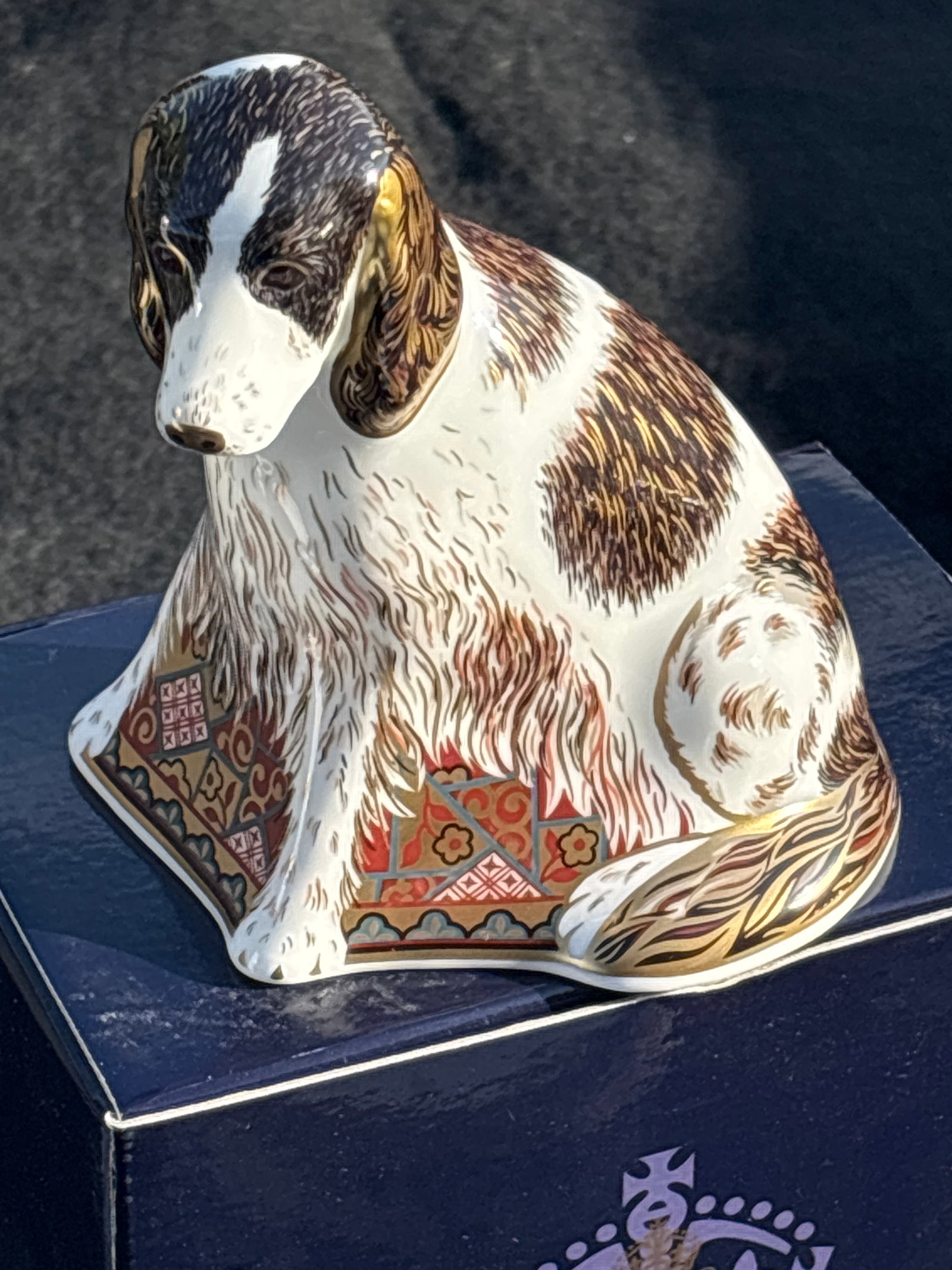 Royal Crown Derby "Molly" porcelain dog 4&1/4 inch paperweight: Gold stopper. With box. Royal Crown Derby "Molly" porcelain dog paperweight, featuring an Imari-style pattern with gold accents and a gold stopper. Model: Molly the dog, modelled by Mark Delf and desi