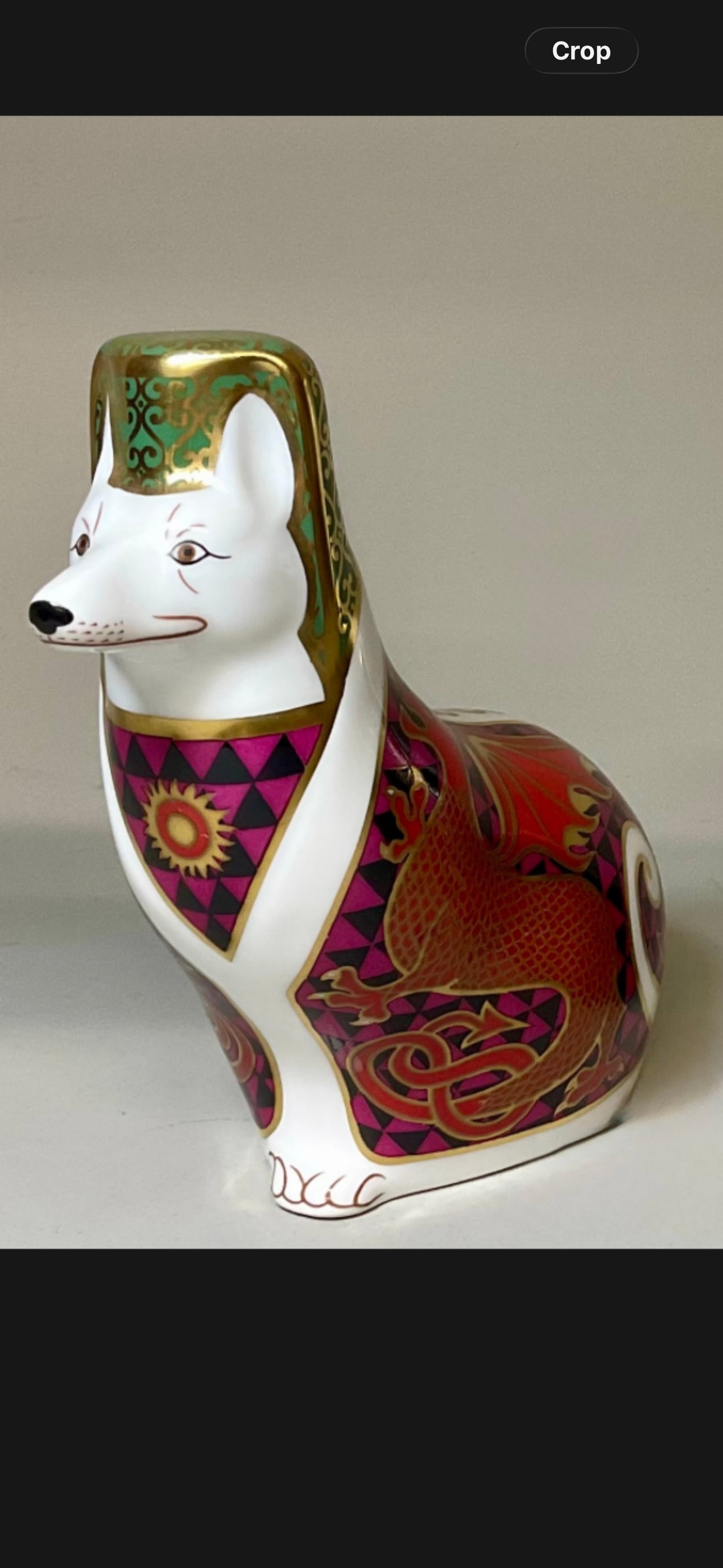 Royal Crown Derby Corgi figurine from the National Dogs collection: Royal Crown Derby Corgi figurine from the National Dogs collection, designed by Sue Rowe and dated around 1991. Design Details: The figure is decorated in an Imari-style palette of red, purple, and go