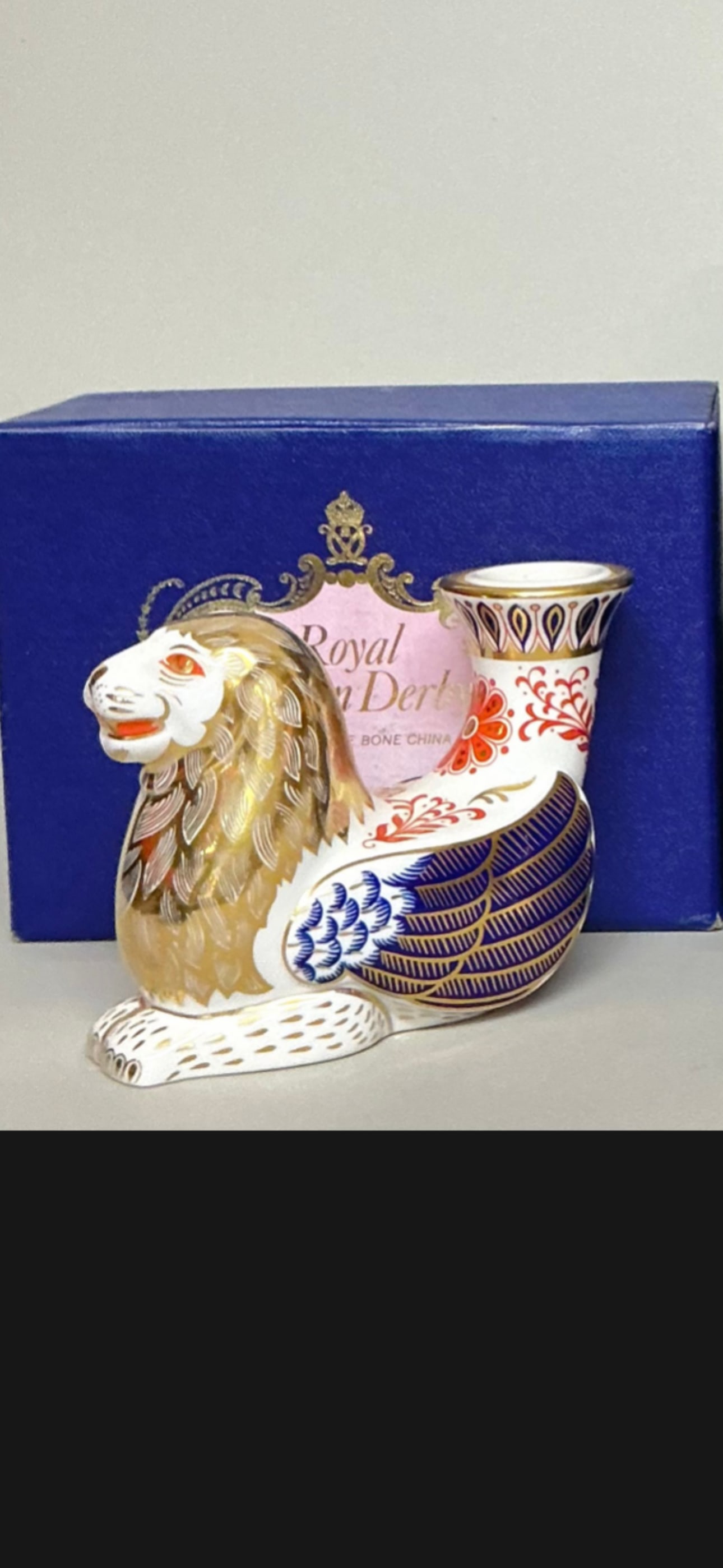candle/paperweight Royal Crown Derby "Winged Lion’ figurine from Mythical Beasts Series: Royal Crown Derby "Winged Lion" figurine from the Mythical Beasts Series. Goodman's Antiques & Estate JewelryThis piece functions as both a decorative paperweight and a taper candle holder.It is craft