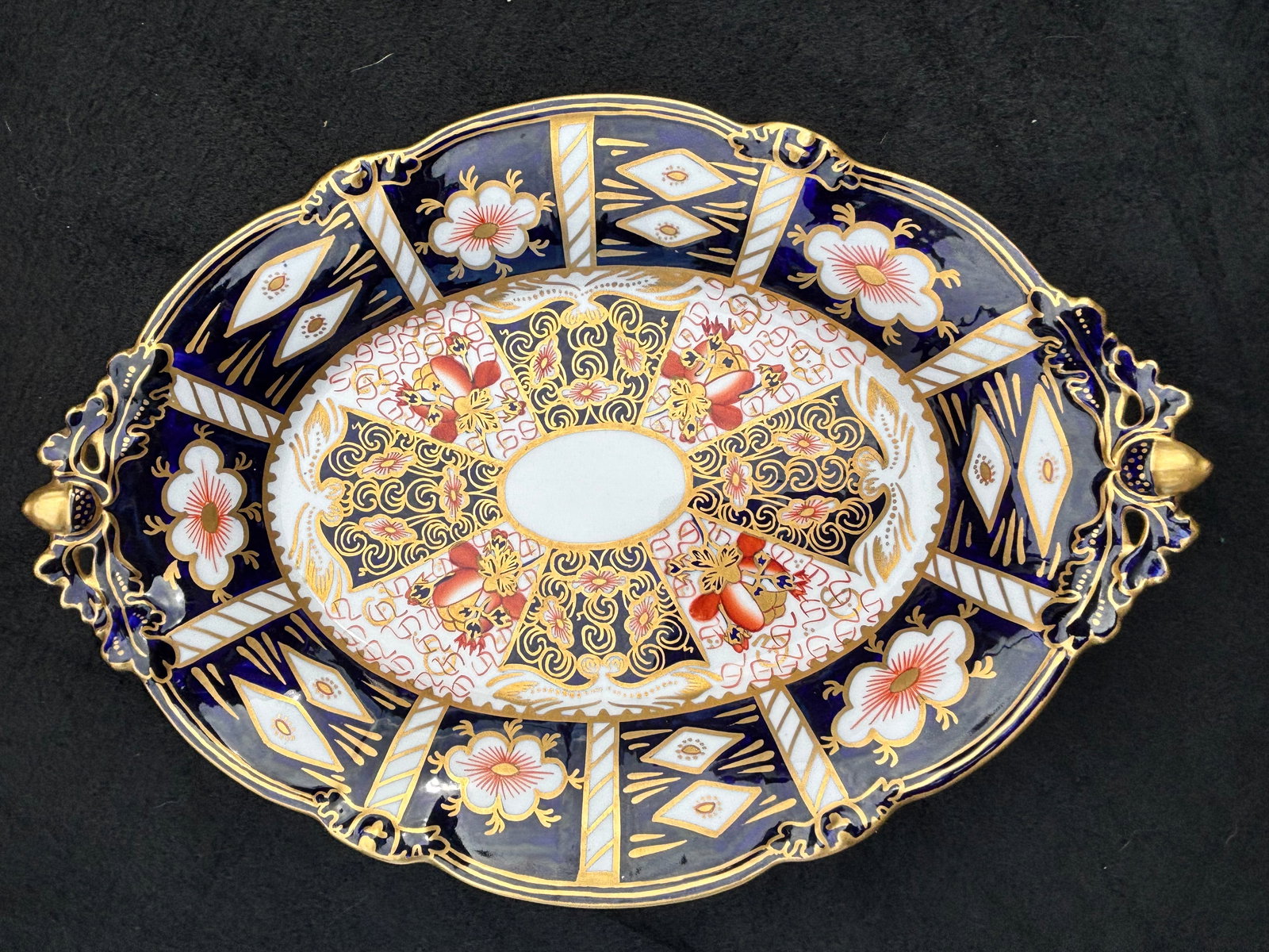 9&1/2 inch footed dish Royal Crown Derby Traditional Imari #2451 dinner plate: Royal Crown Derby Traditional Imari oval footed serving dish, crafted from fine bone china in England. It features the iconic pattern #2451, which was first introduced in the early 20th century and re