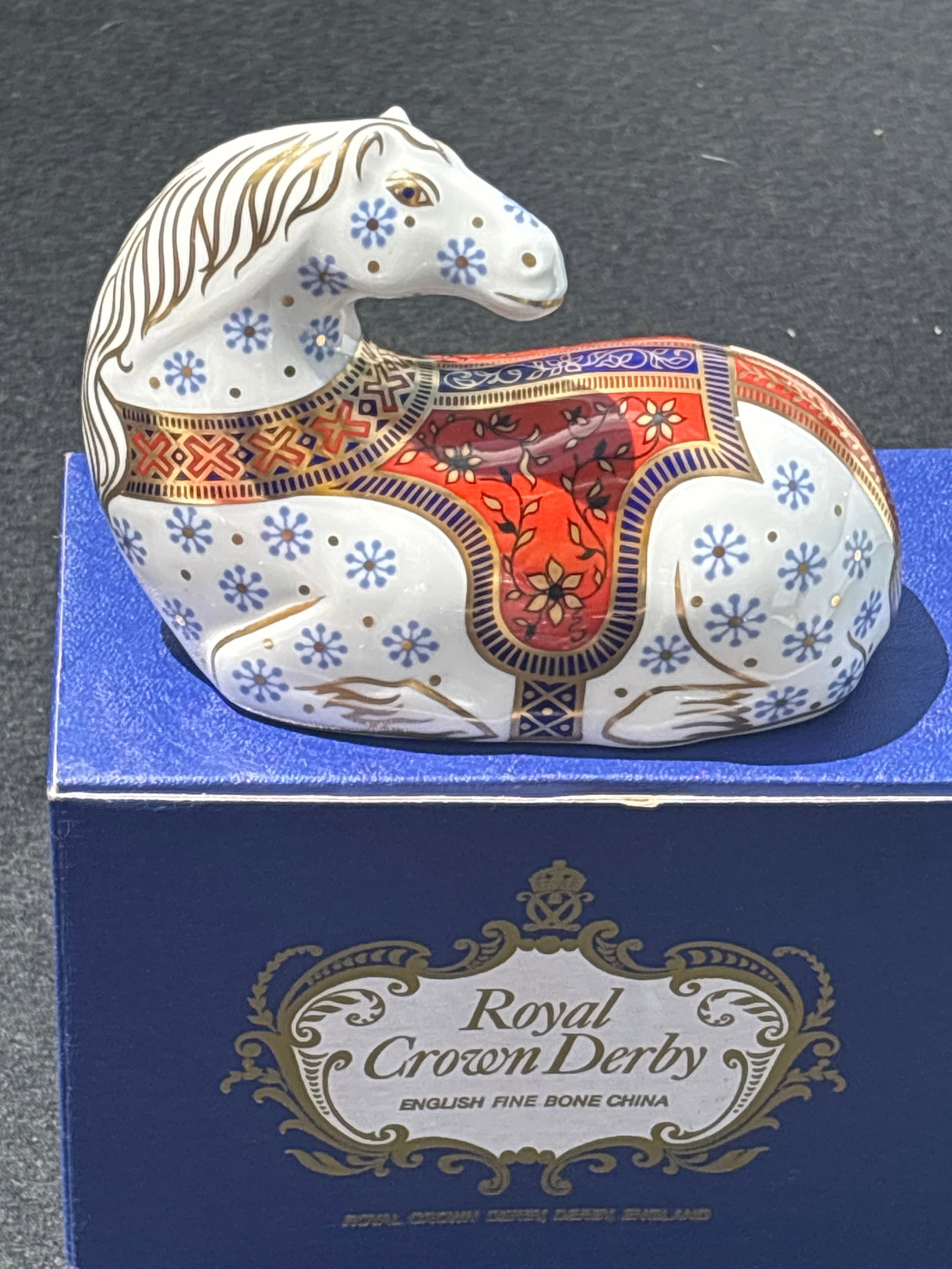Royal Crown Derby Imari Horse paperweight, crafted from fine English bone china: Royal Crown Derby Imari Horse paperweight, crafted from fine English bone china.The "Imari" style is a classic design for the brand, defined by its vivid colors—primarily cobalt blue and iron red—